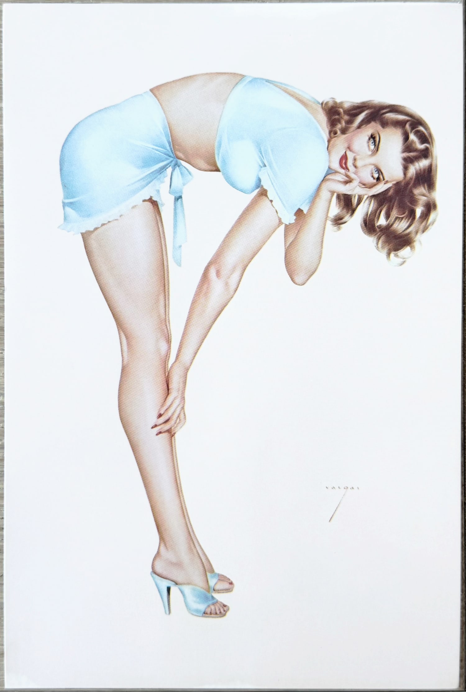 Alberto Vargas Pin-Up "Brunette in Blue Dress" 1979 Postcard: A playful Vargas Girl illustration featuring a curvaceous blonde in a sheer white babydoll top and matching tied shorts. She bends forward playfully, one hand resting on her leg and the other under he