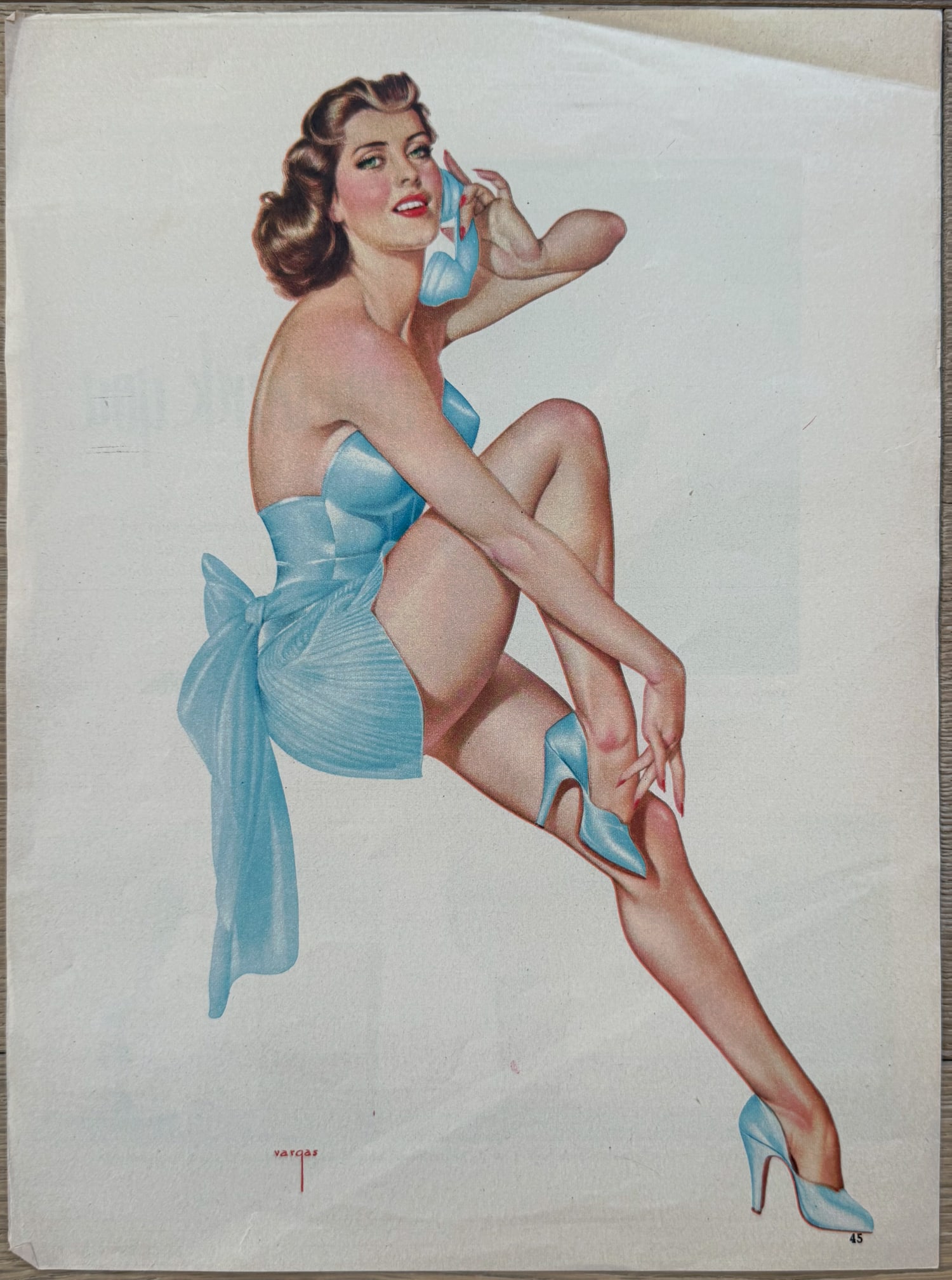 Alberto Vargas Esquire Magazine Artist Proof November 1944: This is an artist proof/magazine clipping of a brunette in blue with phone for Esquire Magazine November 1944.