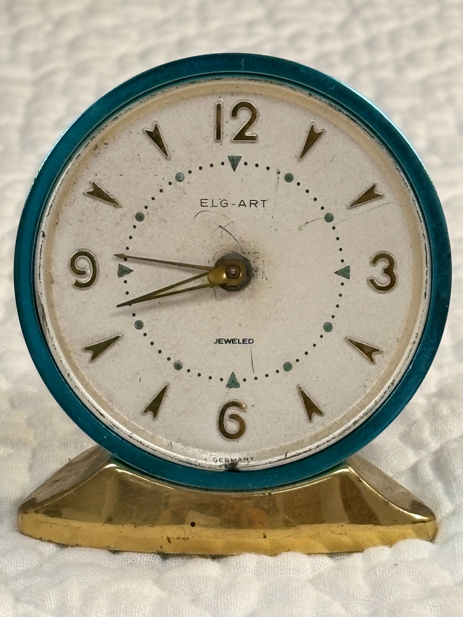 Vintage German ELG-ART Jeweled Alarm Clock: Compact vintage ELG-ART alarm clock, made in Germany. Jeweled movement with original turquoise bezel and brass base. Clean dial with applied numerals. Runs and alarms, showing normal age wear