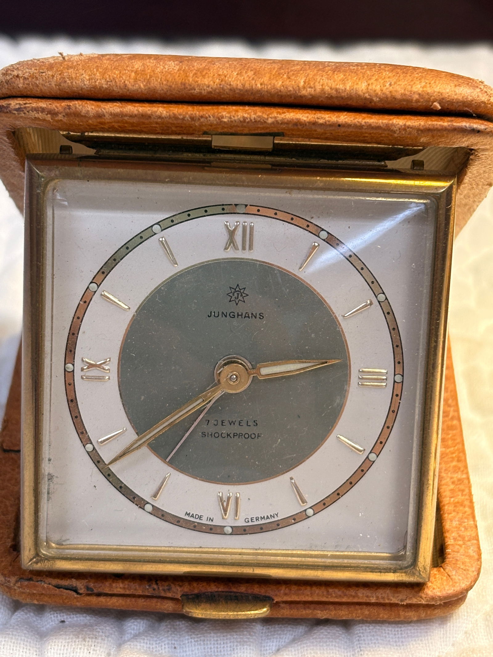 Vintage Junghans Travel Alarm Clock, 7 Jewels, Leather Case, Germany: Authentic vintage Junghans mechanical travel alarm clock, Made in Germany, featuring a 7-jewel shockproof movement. Square brass case housed in its original folding leather travel case (brown).