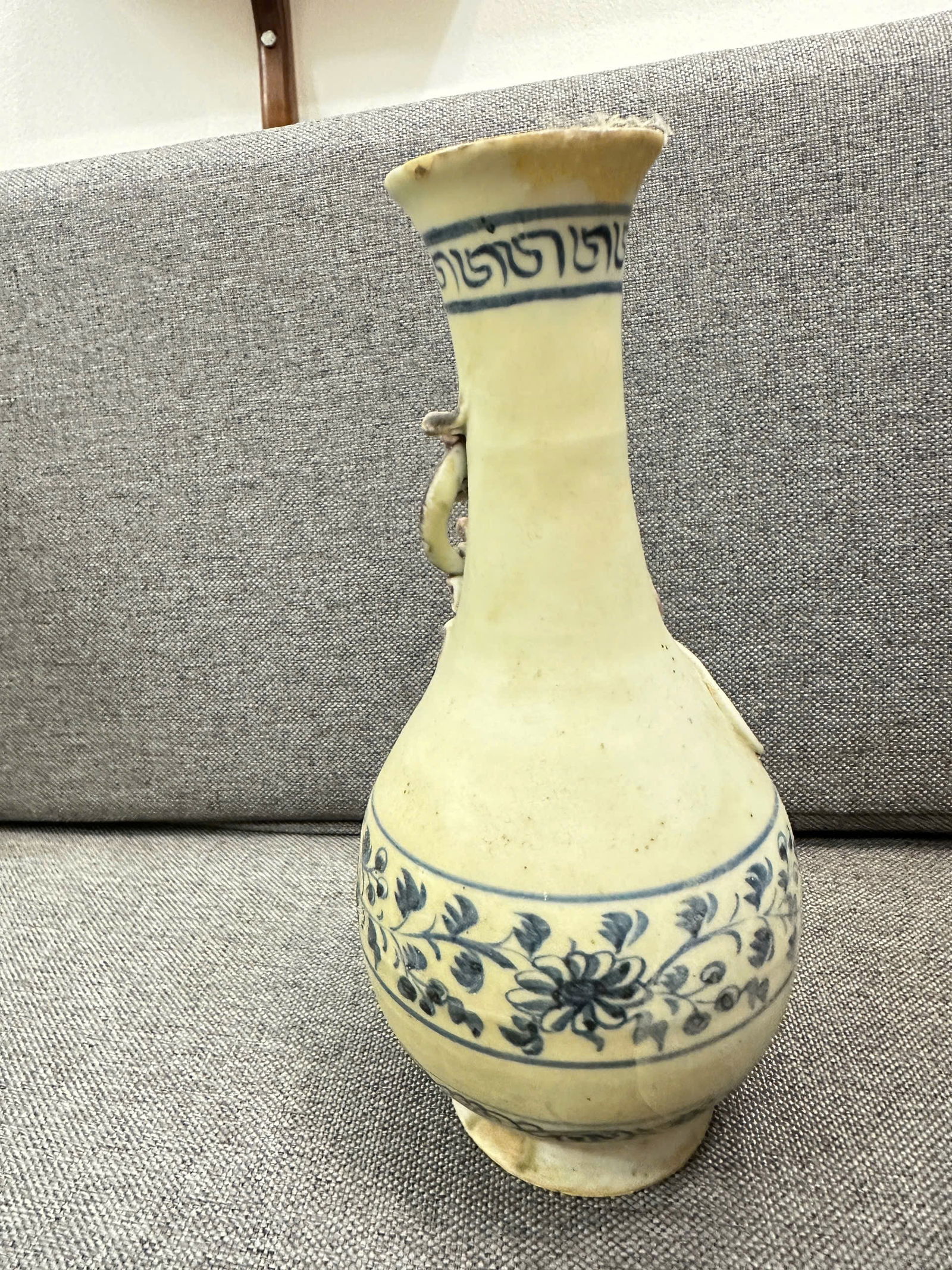 Chinese Blue & White Porcelain Vase with Applied Dragon Handle Late Qing Dynasty: Baluster-form porcelain vase decorated in underglaze blue floral scrolls, with a molded and applied dragon-form handle at the shoulder. The glaze shows natural age toning and surface wear consistent w