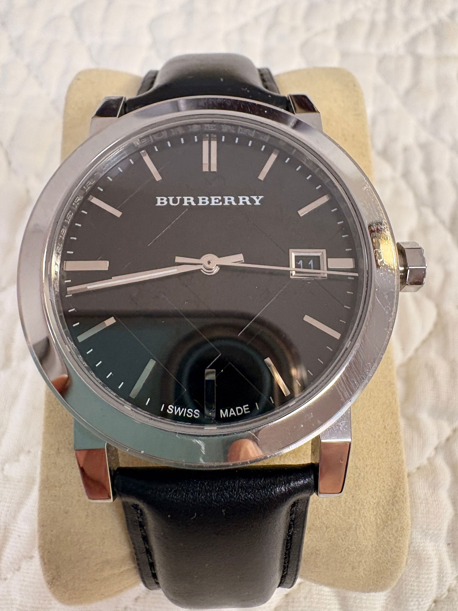 Burberry Swiss Made Men’s Wristwatch (New Old Stock): Vintage Burberry men’s wristwatch in never worn, original condition. Swiss made, sapphire crystal, stainless steel case, and original Burberry leather strap with signed buckle. Dial, case, and