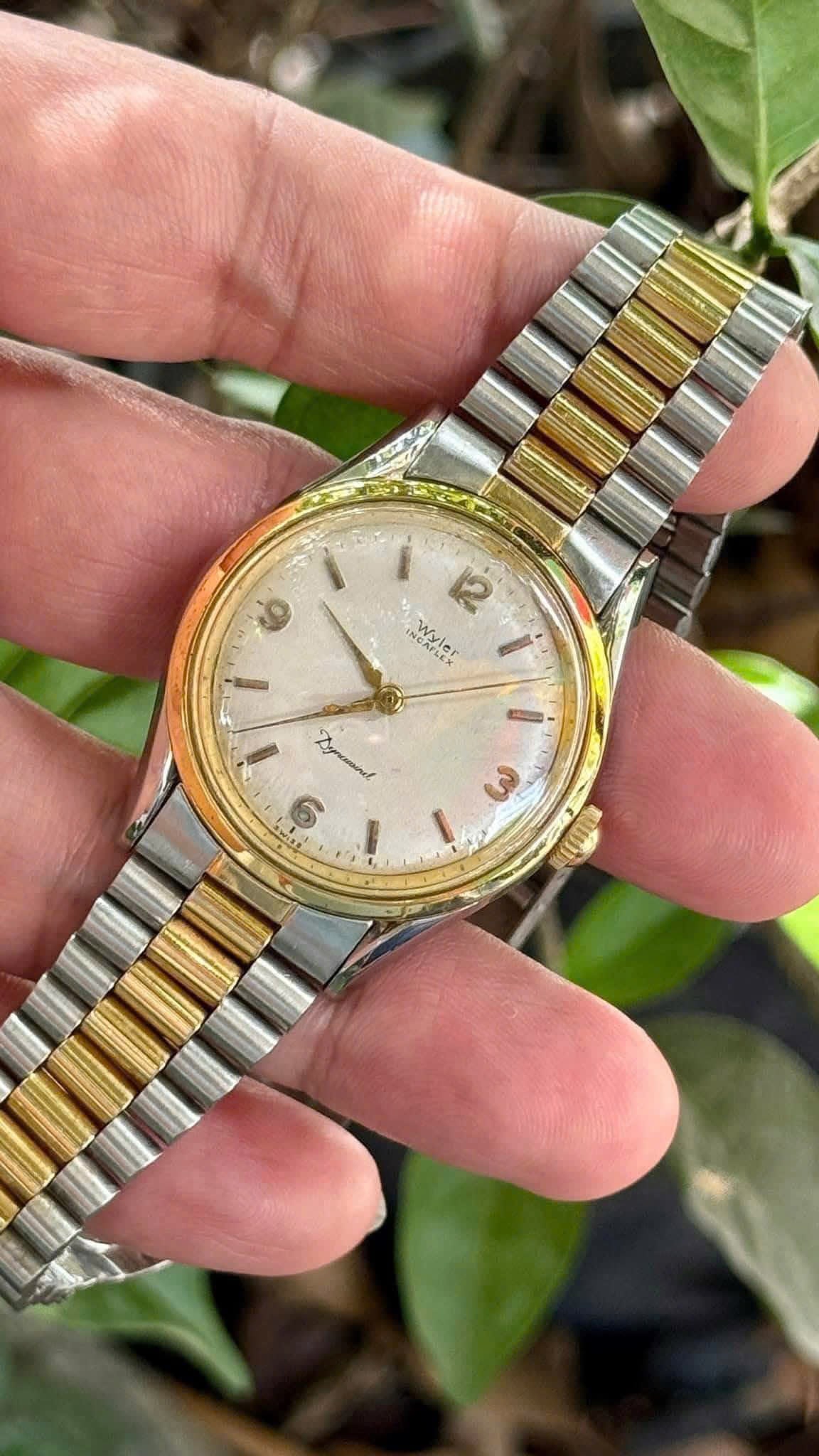 Vintage Wyler Incaflex “Dynawind” Automatic Wristwatch: Vintage Wyler Incaflex “Dynawind” Automatic WristwatchSwiss-made automatic watch by Wyler Incaflex, featuring the Dynawind movement. Two-tone stainless steel and gold-tone case with matching