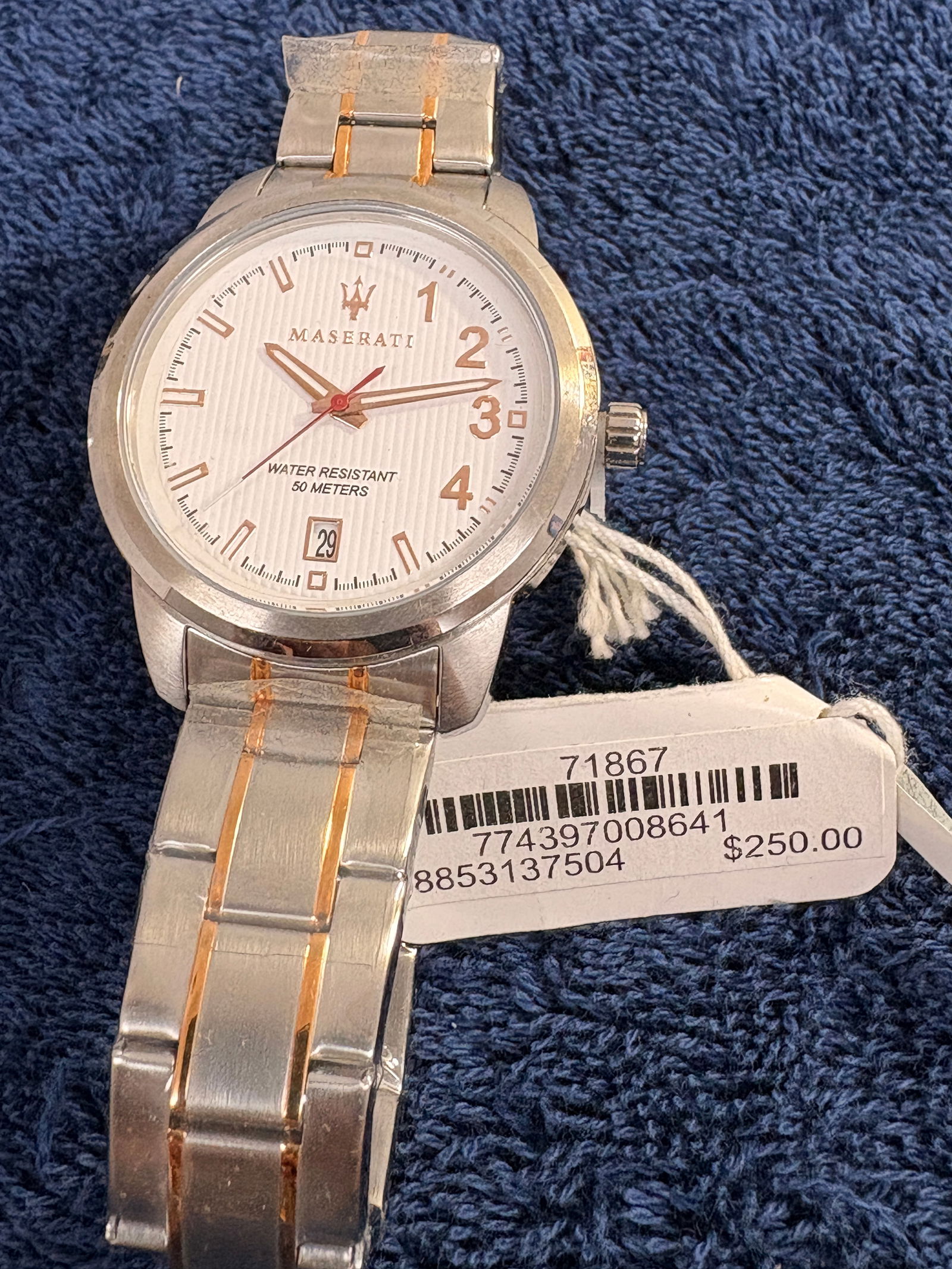 Maserati Stainless Steel Quartz Wristwatch: Modern Maserati men’s wristwatch featuring a silver-tone stainless steel case and bracelet with rose-gold accent links. White textured dial with applied rose-gold numerals and hands, central