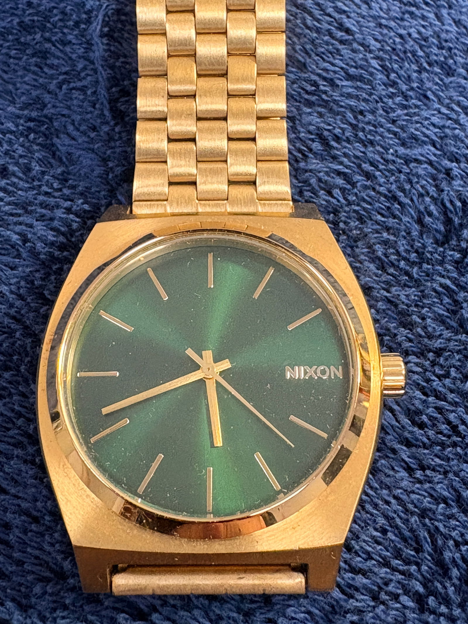 Nixon “The Time Teller” Gold-Tone Watch: Minimalist Nixon Time Teller with green sunburst dial and gold-tone bracelet. Japan quartz movement. Approx. 37–39 mm case. Surface wear present. Running condition - tested. Clean modern everyday
