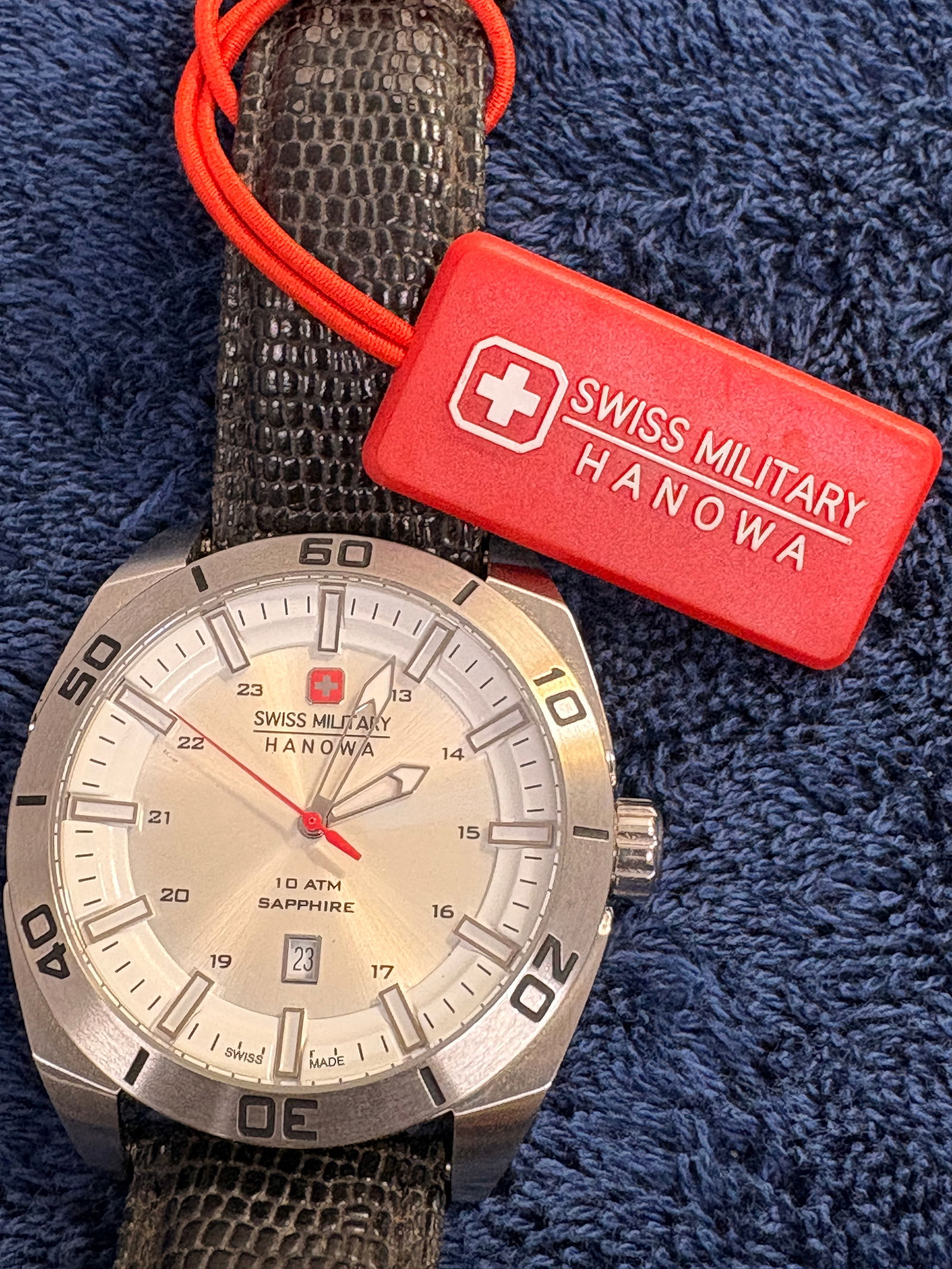 Swiss Military Hanowa Men’s Diver Watch, Sapphire, 10 ATM: Attractive Swiss Military Hanowa quartz diver featuring a brushed silver dial, sapphire crystal, and 10 ATM water resistance. Date display at 6 o’clock and bold sport bezel give it a strong wrist