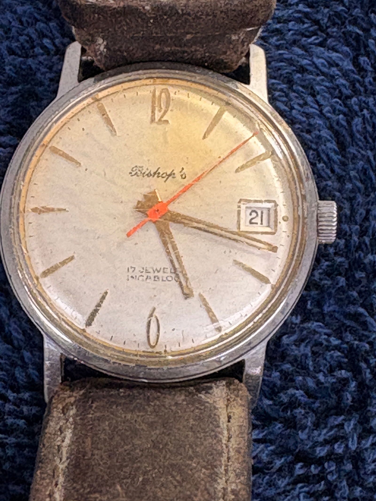 Bishop’s 17 Jewels Incabloc Automatic Date Watch: Vintage Bishop’s automatic wristwatch featuring 17 jewels Incabloc movement, stainless steel case, and date display. Classic mid-century styling with warm patina and original character. Mounted on a