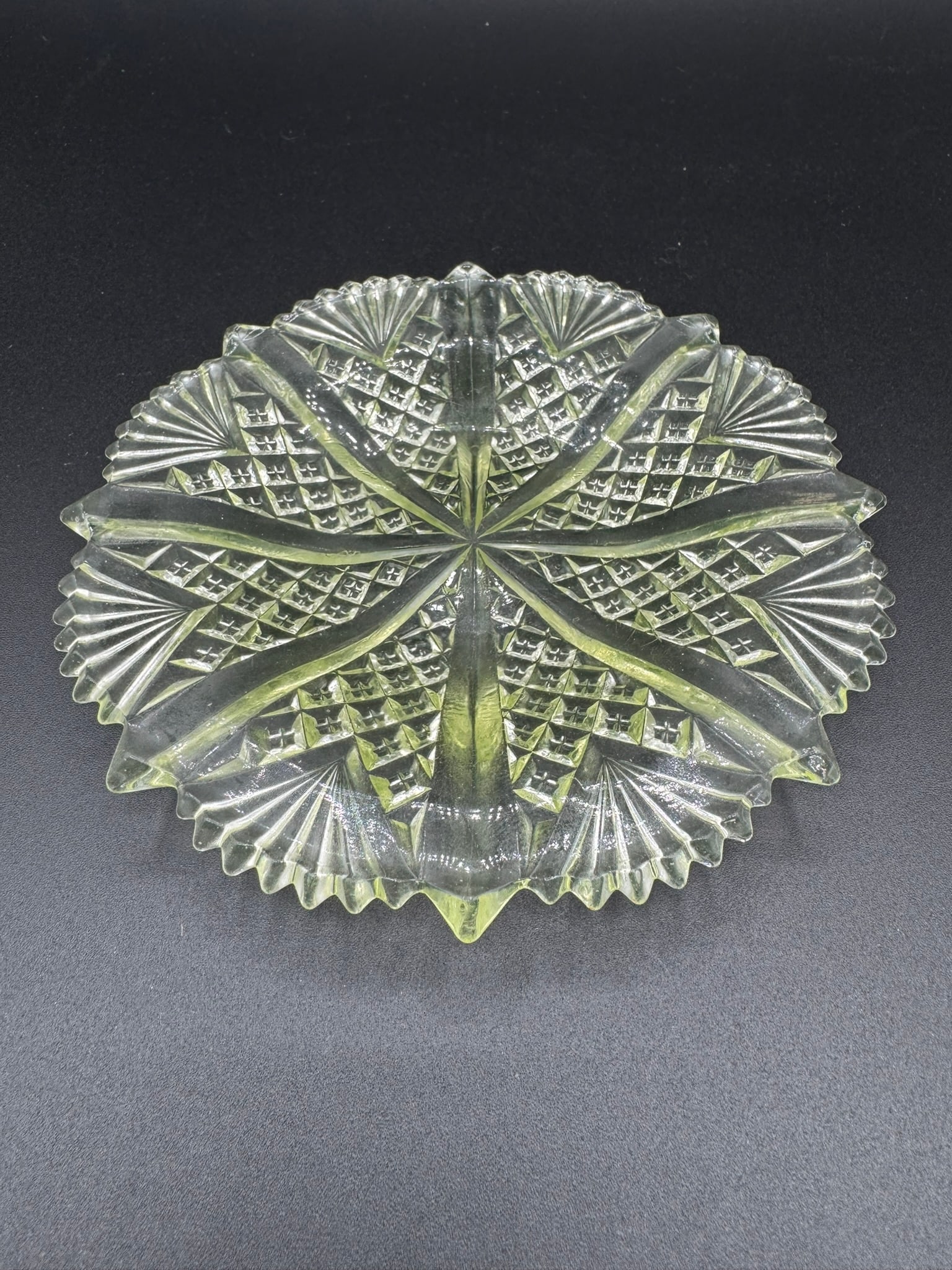 Vintage Vaseline Glass Uranium Cut Glass Dish: This is a striking vintage Vaseline glass dish made from uranium-infused glass, which gives it the iconic fluorescent green glow under UV/blacklight. Measuring approximately 5.5 inches in diameter, th