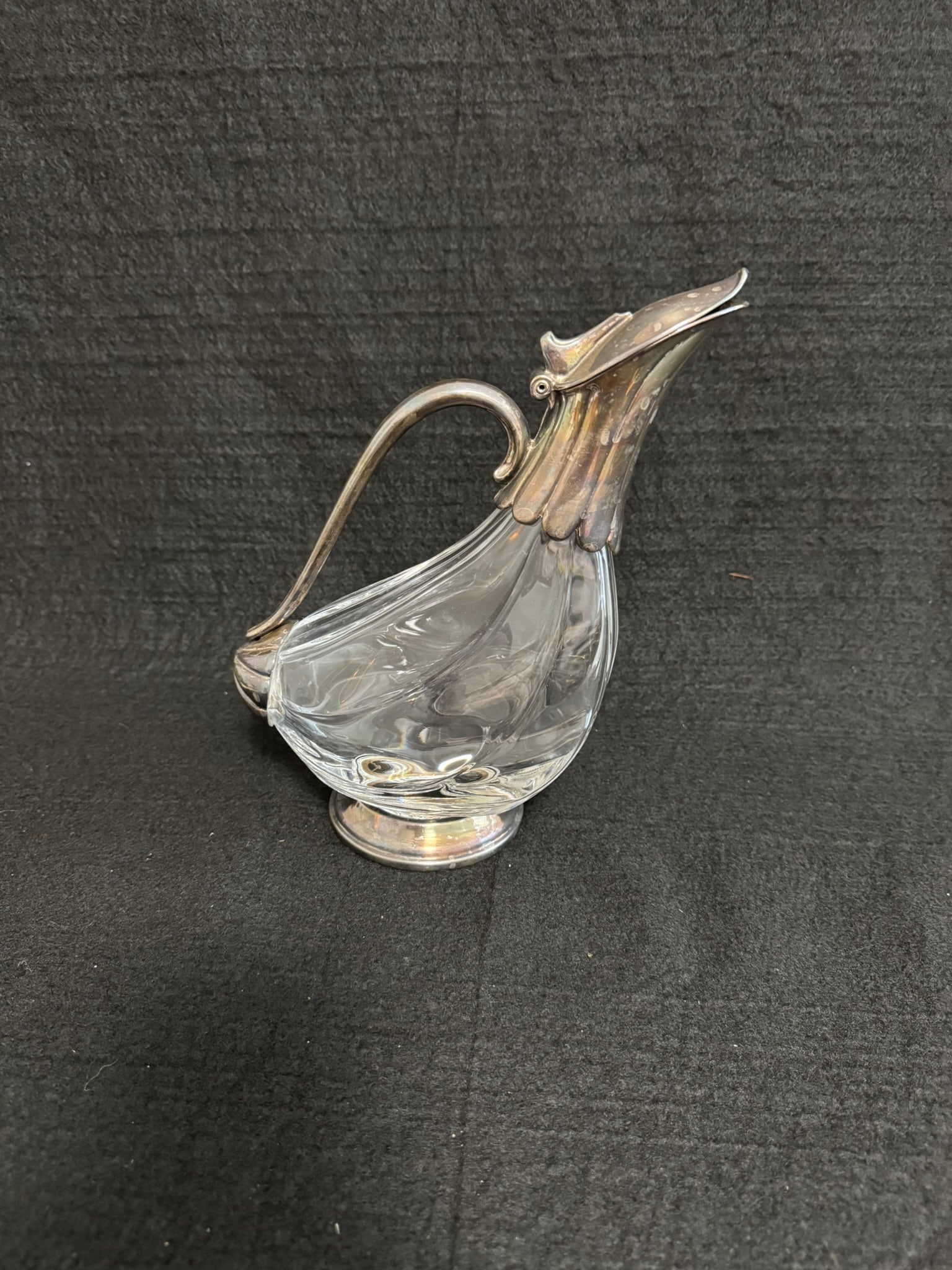 Vintage Art Nouveau Glass & Silverplate Claret Jug: Vintage Art Nouveau Glass & Silverplate Claret Jug – Figural Lid Design A striking vintage claret jug featuring a sculptural glass body with sinuous Art Nouveau lines and elegant silverplate mountin