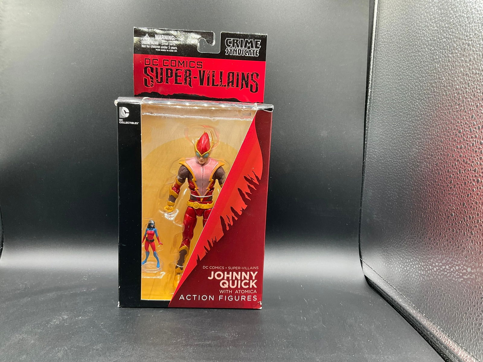 Description: DC Comics Super-Villains Johnny Quickaction figure with Atomica, part of the Crime (1 of 3)