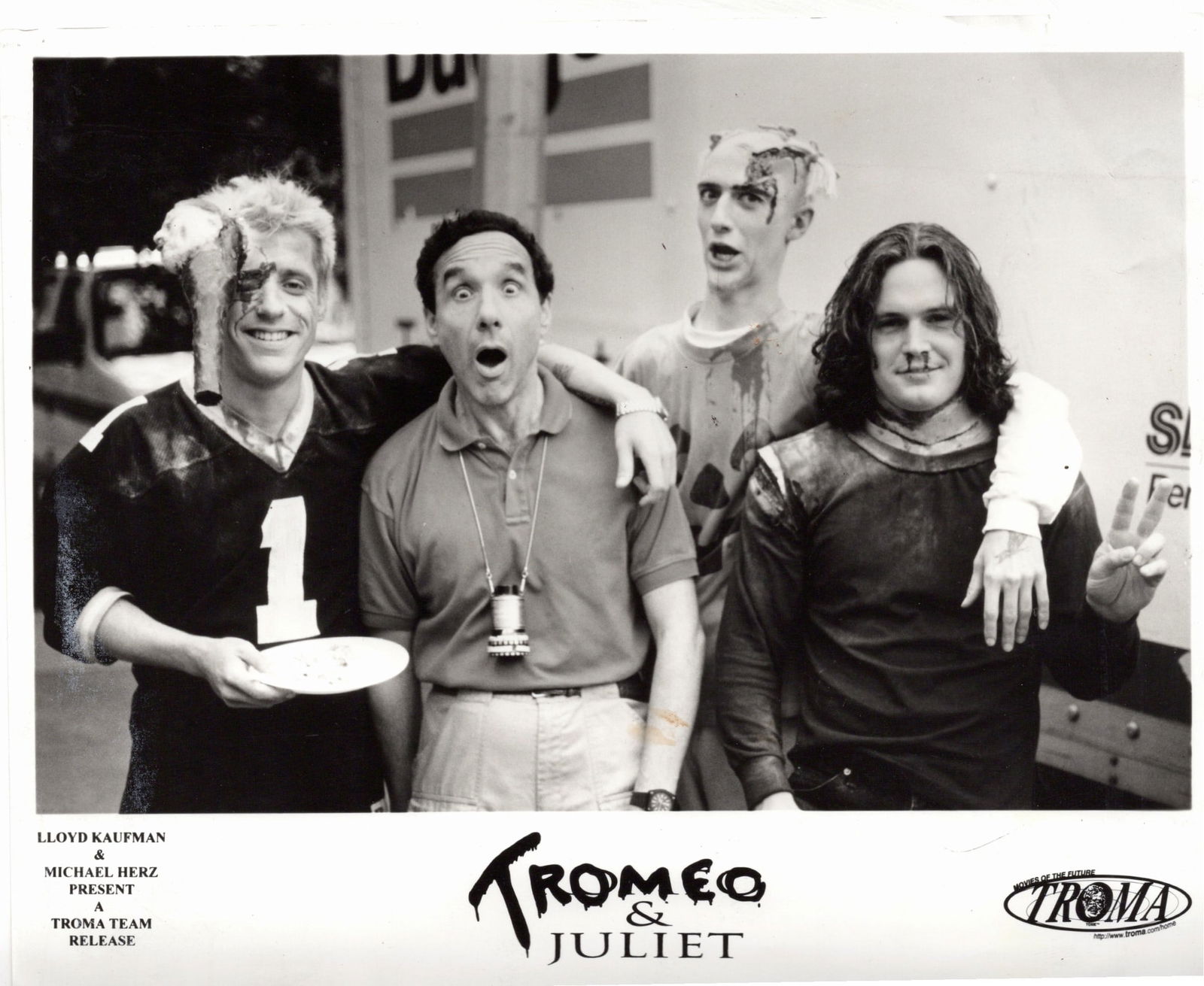 Tromeo & Juliet (1996) – Cast & Crew Photograph Original black-and-white production photograph: Tromeo & Juliet (1996) – Cast & Crew Photograph Original black-and-white production photograph from the cult classic film Tromeo & Juliet, released by Troma Entertainment and directed by Lloyd Kaufm