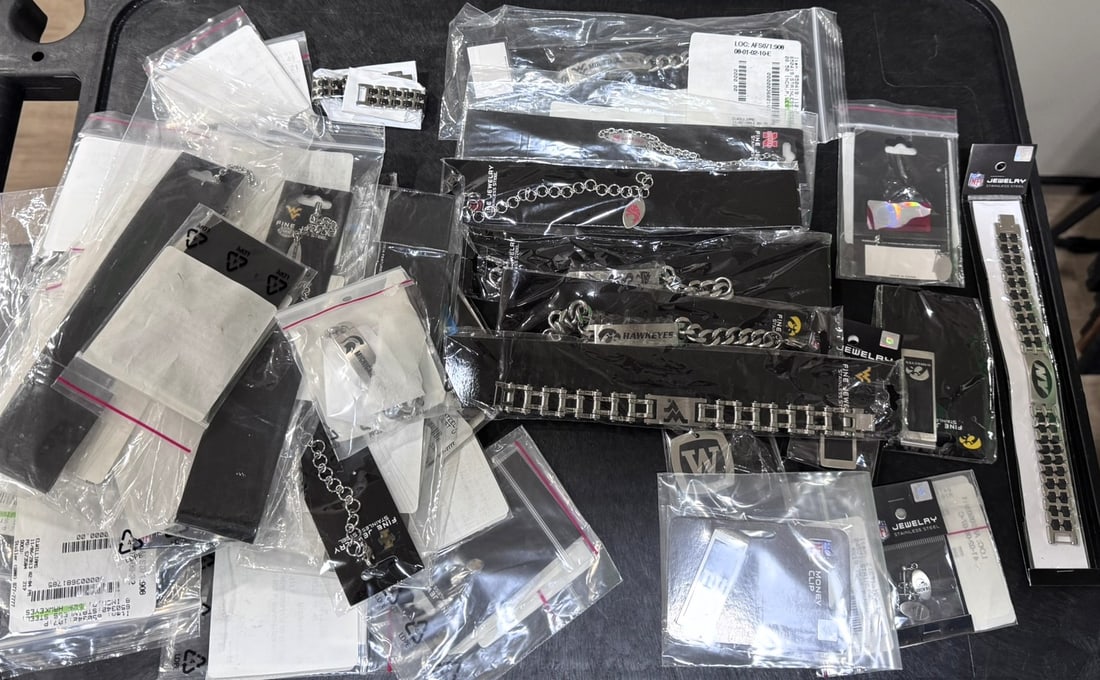 Large resale bundle featuring over 40 officially licensed NCAA and NFL jewelry items, (1 of 2)