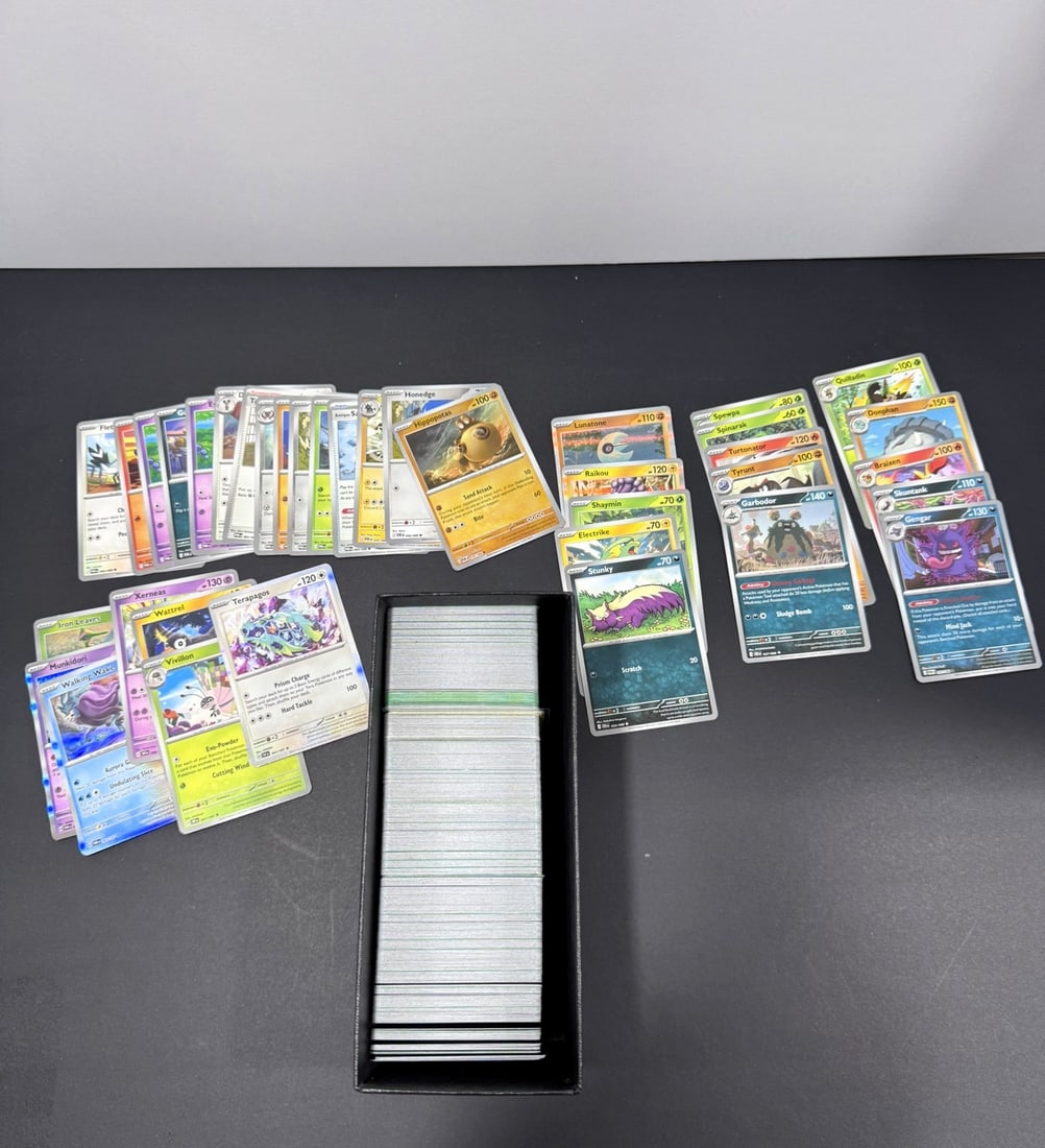 Pokémon Bulk Card Collection: This Pokémon Trading Card Game bulk lot includes approximately 400-600 cards spanning several modern Scarlet & Violet expansions, with the majority from Perfect Order (POR) and Chaos Rising (CRI)