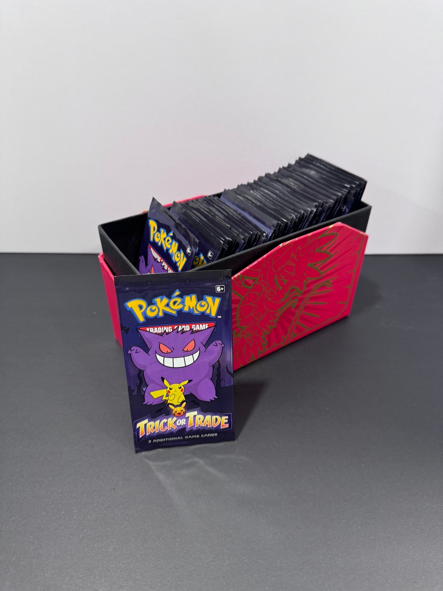 Pokémon Trick or Trade Sealed Mini Booster Pack Lot (Approx. 90 Packs): This lot includes approximately 90 sealed Pokémon Trading Card Game Trick or Trade mini booster packs. Each factory-sealed pack contains three Pokémon cards and was produced as part of Pok&#