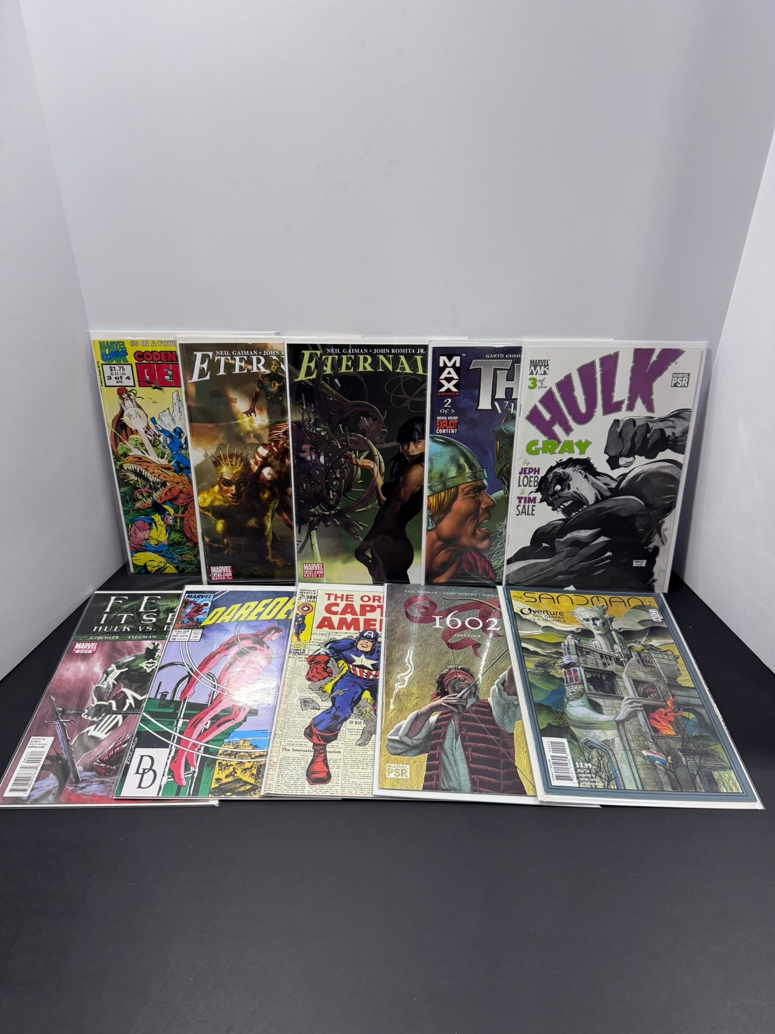 Marvel & DC Mixed Comic Book Lot (10 Books): Eclectic collection of ten Marvel and DC comic books featuring a mix of modern and Bronze Age titles. Highlights include Eternals by Neil Gaiman and John Romita Jr., Hulk: Gray by Jeph Loeb and Tim Sa