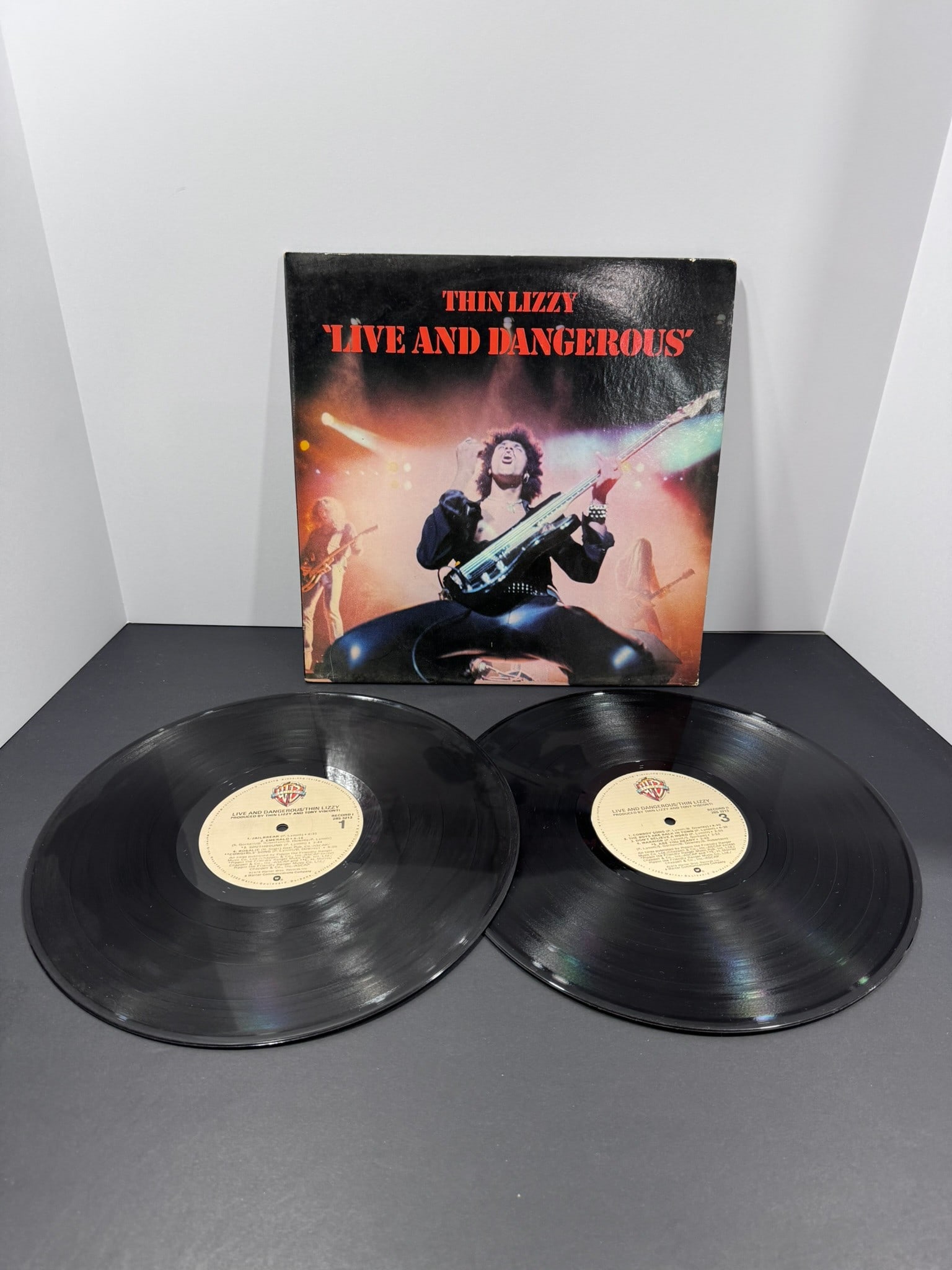 Thin Lizzy – Live and Dangerous (Warner Bros., 1978) 2LP Vinyl Record: Live and Dangerous is widely regarded as one of the greatest live rock albums ever released and captures Thin Lizzy at the height of their career. Originally released in 1978, this double LP features