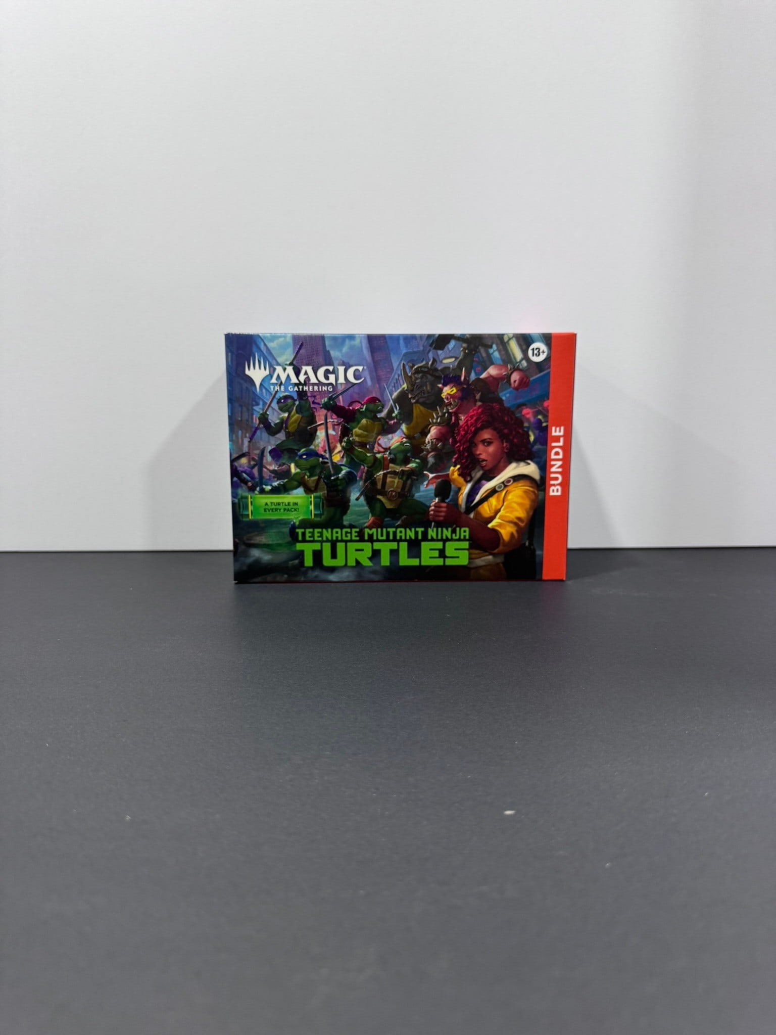 Magic: The Gathering x Teenage Mutant Ninja Turtles Bundle (Factory Sealed): Factory-sealed Magic: The Gathering x Teenage Mutant Ninja Turtles Bundle, part of the Universes Beyond crossover series from Wizards of the Coast. This collectible bundle combines the strategic