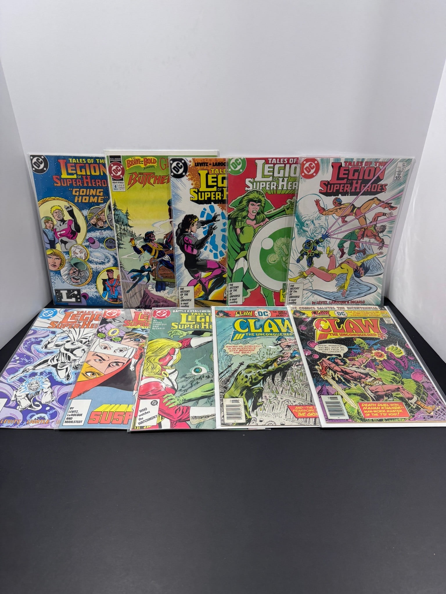 DC Bronze & Copper Age Comic Book Lot (10 Books): Collection of ten Bronze and Copper Age DC comic books featuring Tales of the Legion of Super-Heroes, Claw the Unconquered, and The Butcher. This lot includes several Legion issues from the acclaimed 