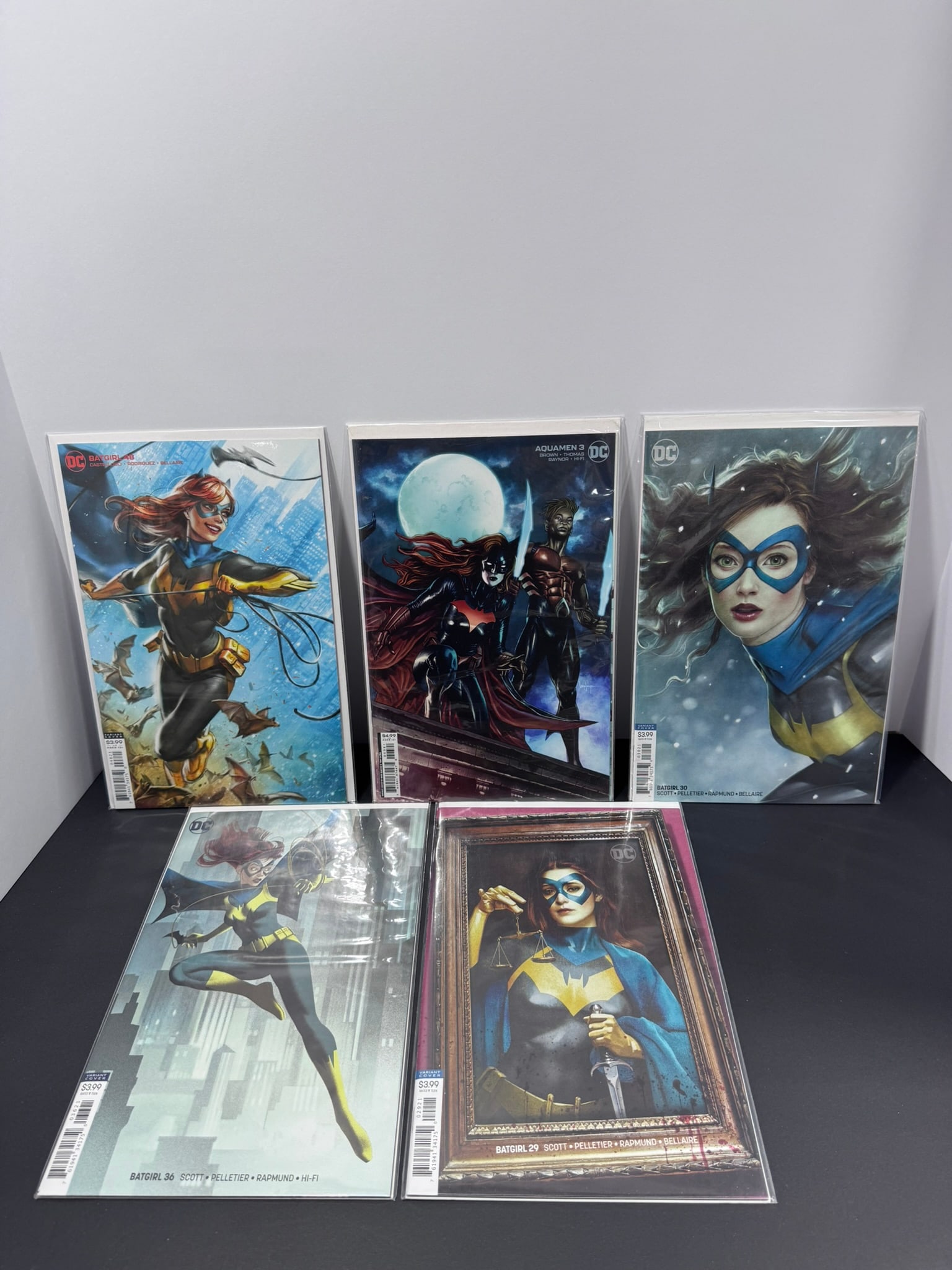 DC Batgirl Variant Cover Comic Lot (5 Books): This five-book DC Comics lot features a beautiful selection of modern Batgirl variant covers, highlighted by artwork from acclaimed cover artists Stanley "Artgerm" Lau and Joshua Middleton. These