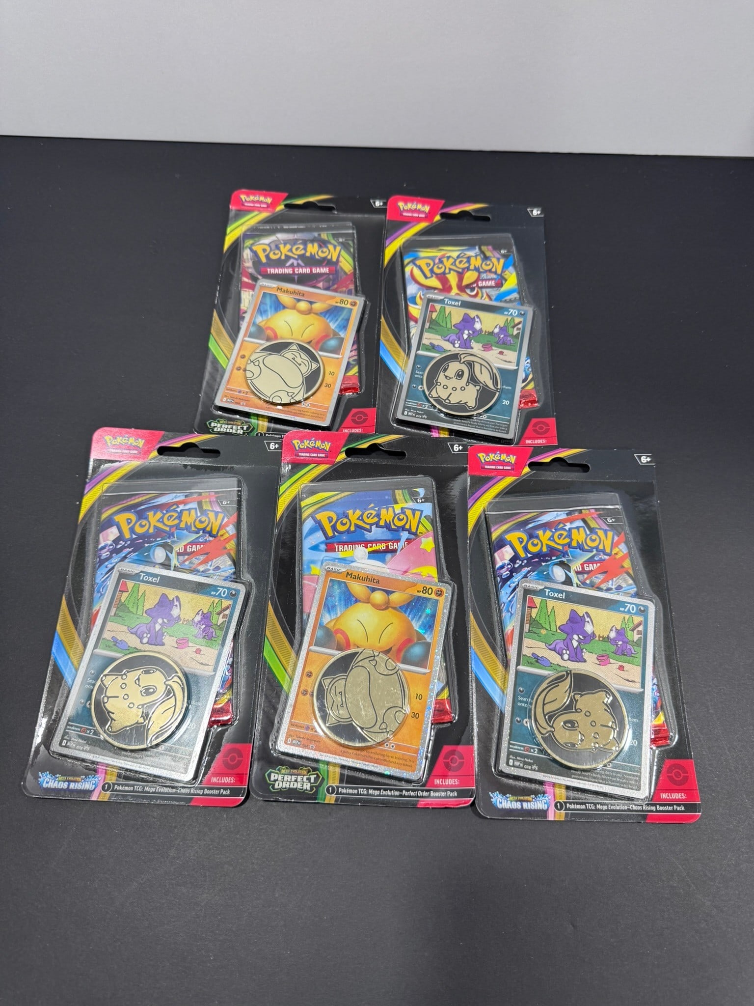Pokémon TCG Mega Evolution Checklane Blister Lot: Lot of five (5) factory sealed Pokémon Trading Card Game Mega Evolution Checklane Blister Packs. Each blister includes one Mega Evolution booster pack, one promotional card, and one collectible