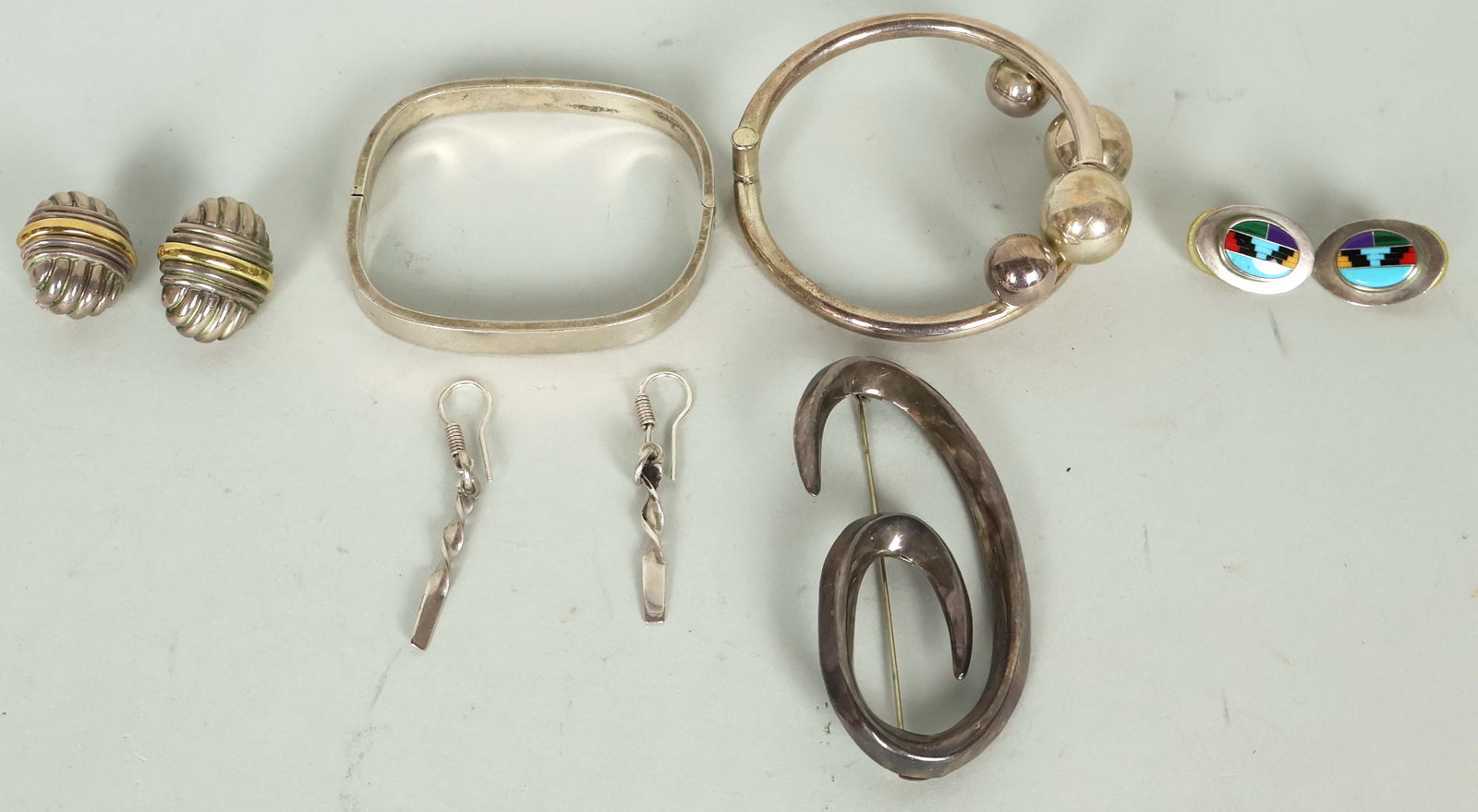 Sterling Silver Handmade Jewerly. A Beautiful Selection of Very Unique Pieces!: Sterling Silver Handmade Jewerly. A Beautiful Selection of Very Unique Pieces! Total Weight 82.25 grams. 2 Bracelets, 1 Pin, and 3 pairs of earrings. Good condition!Pickup will take place Friday June