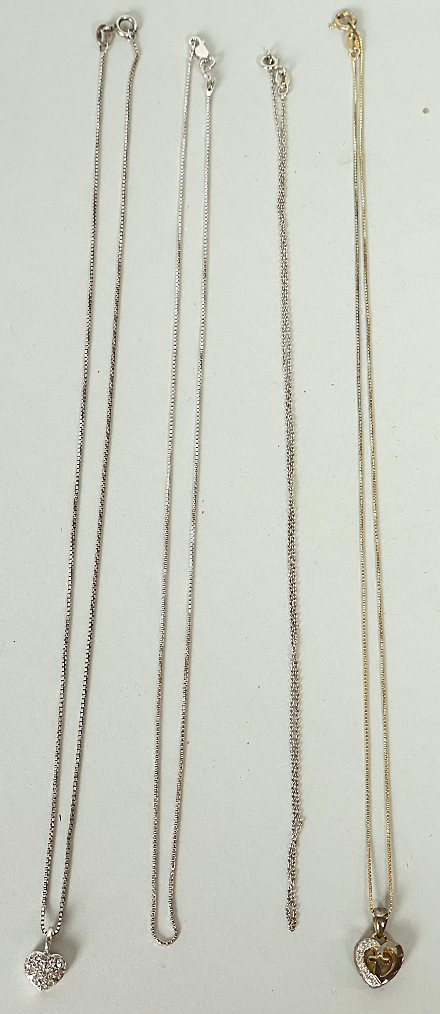 4 18" Silver .925 Chains Two with Diamond Hearts. Nice hot 9.3 Grams!: 4 18" Silver .925 Chains Two with Diamond Hearts. Nice hot 9.3 Grams!Pickup will take place Friday June 13th from 11am-2pm EST. All winners will be sent the address in an email.