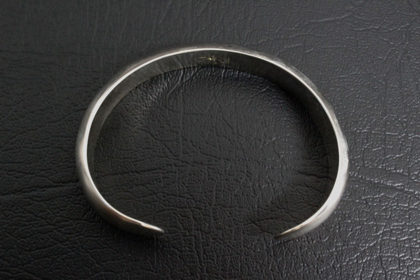 Sterling Silver Cuff Bracelet: A bold and elegant sterling silver cuff bracelet featuring a clean, polished finish and a classic open-back design for easy wear. Its timeless silhouette makes it a versatile statement piece, perfect