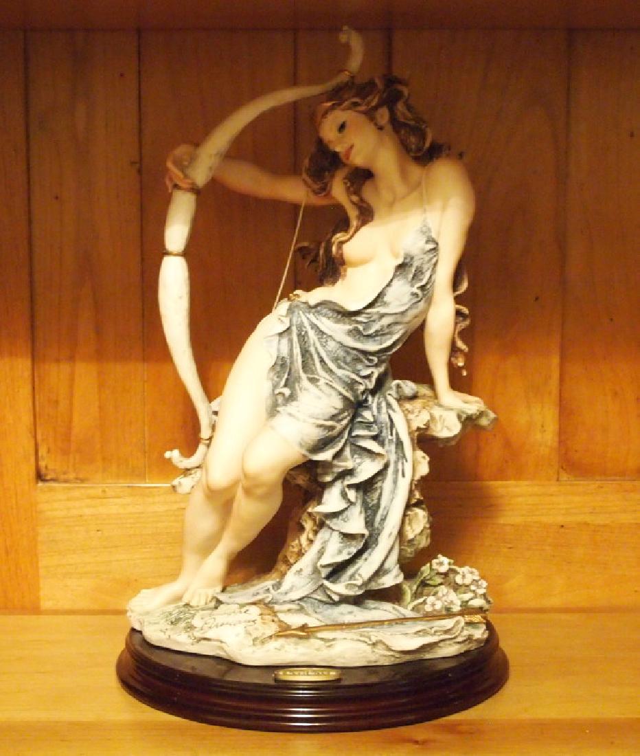 Giuseppe Armani, Diana: A Giuseppe Armani composition figure for Florence Sculpture d' Arte. Depicting "Diana", a seated nude with her arm around a bow, and an arrow at her feet. Signed "Giuseppe Armani" at the base. Mounted