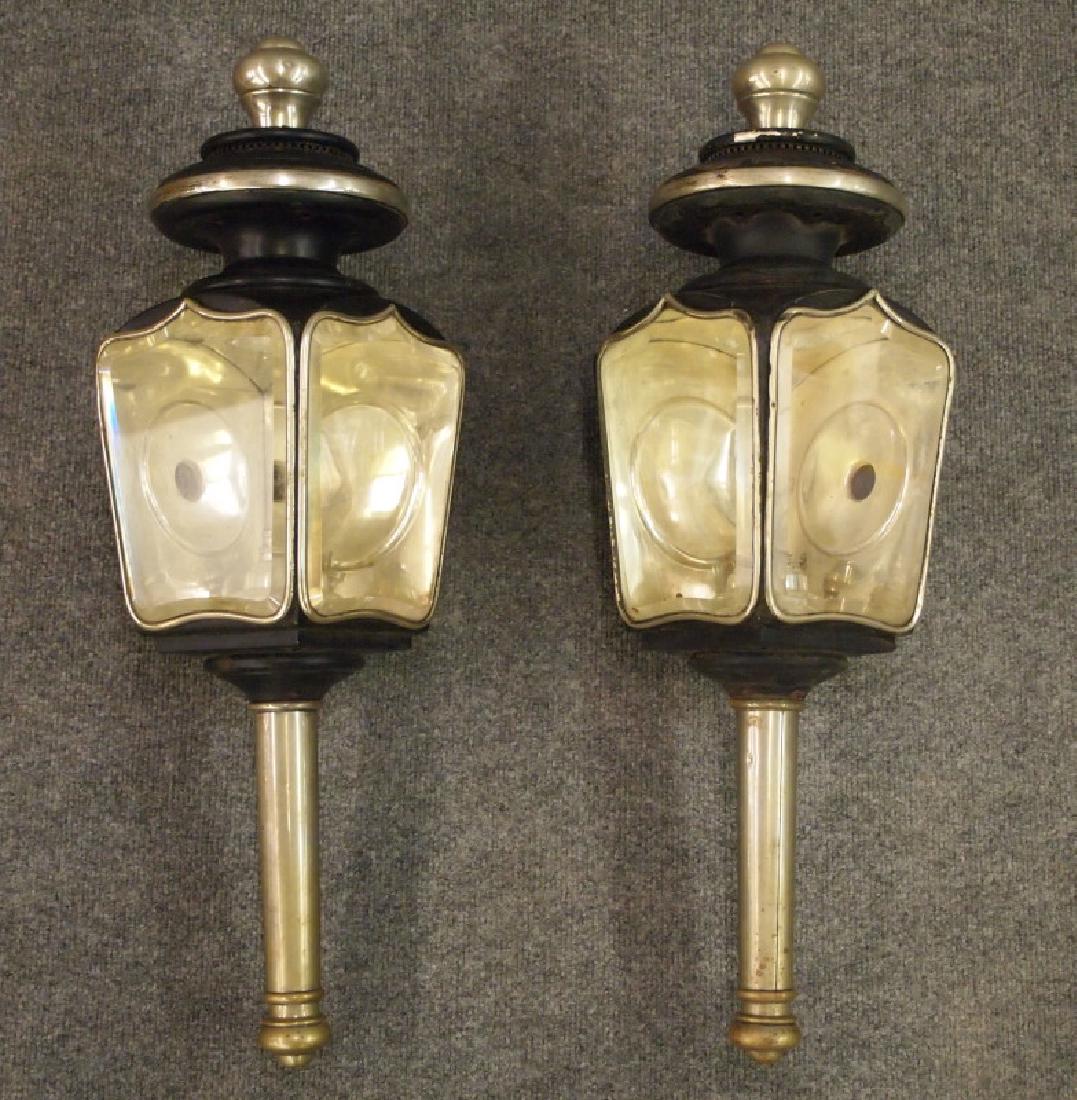 Pr brass coach lanterns: A pair of 19th century brass coach lanterns by White Mfg. Co. of Bridgeport, Conn. Nickel-plated brass and painted black tin, each has two beveled glass panels and a hinged door at the back centered b