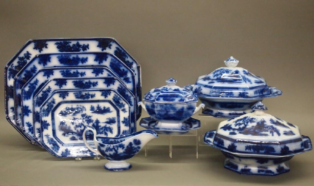 97 pc Wedgwood Chapoo dinnerware: A mid 19th century Wedgwood Ironstone flow blue dinner set, 97 pieces. In the "Chapoo" pattern, including 8 dinner plates, 10 luncheon plates, 10 salad plates, 9 rim soup plates, 10 dessert plates, 2