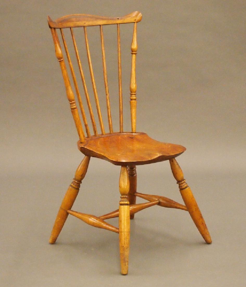 New England fan back Windsor side chair: A late 18th century New England fan back Windsor side chair. Eight spindle back with shaped crest, turned spindles, shaped plank seat and turned stretcher base. Hickory and Maple construction with a P