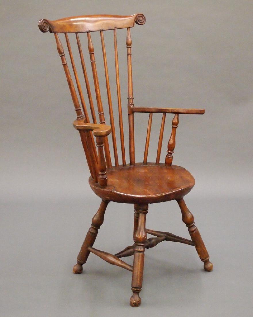 Philadelphia fan back Windsor armchair: An 18th century Philadelphia fan back Windsor armchair. Tall, seven spindle back with shaped crest and carved volutes, shaped arms, turned spindles with spool detail, shaped plank seat and turned stre