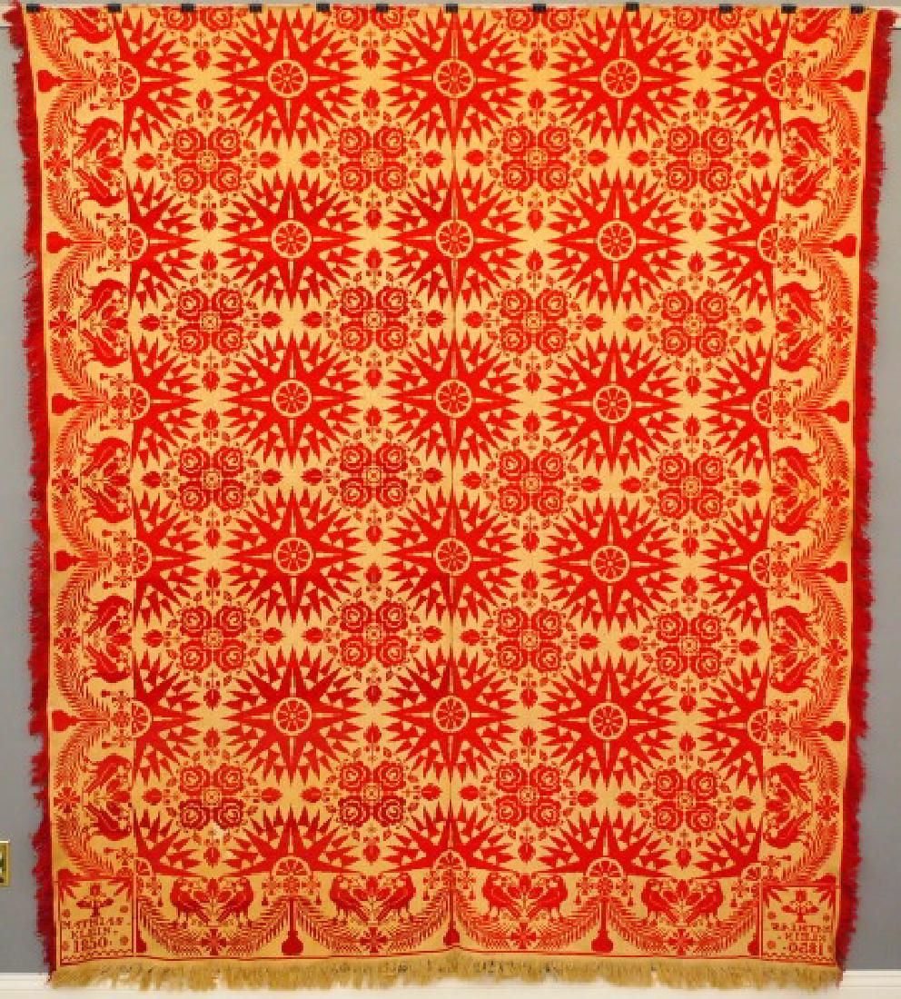 Jacquard coverlet, Mathias Klein: A mid 19th century Jacquard coverlet by Mathias Klein. Two-piece, compass and floral pattern with bird and urn border, in red and white. Inscribed and dated "Mathias Klein, 1850" at the corner blocks.