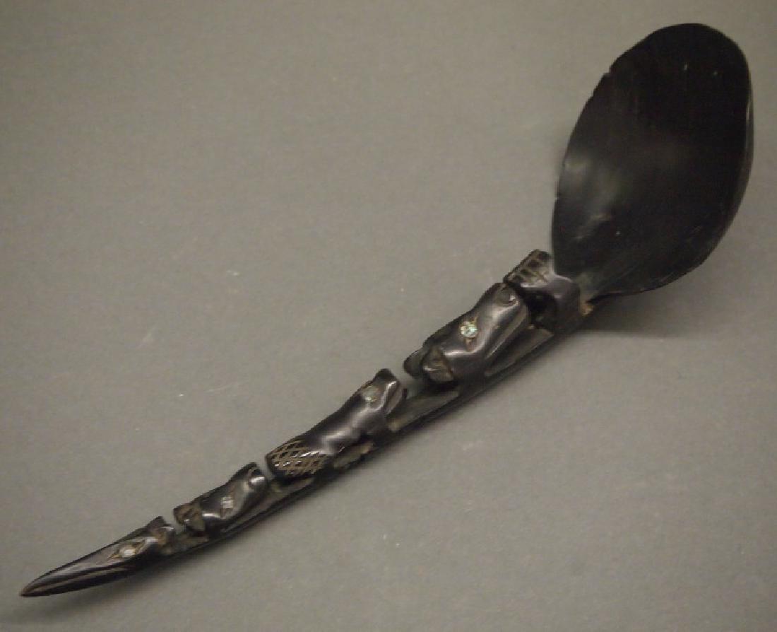 Northwest Coast horn spoon: A circa 1900 Northwest Coast mountain goat horn and abalone spoon, possibly Tlingit or Haida. The handle carved with four animal heads, including a beaver and a raven, their eyes inset with abalone. M