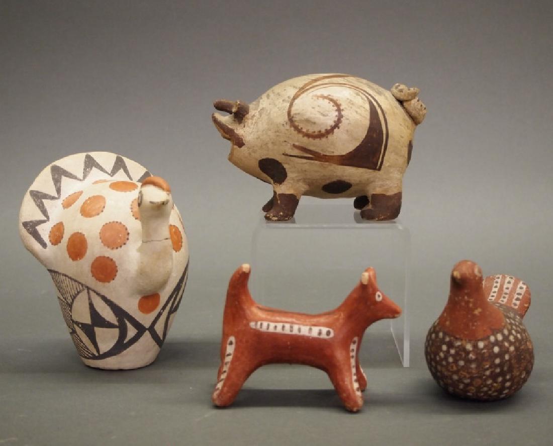 4 Pueblo animal figures: Four early-mid 20th century Southwest American Pueblo pottery animal figures. Including 1 chicken still bank and 1 fox, both similarly decorated in red and brown; together with 1 Acoma peacock, and 1 