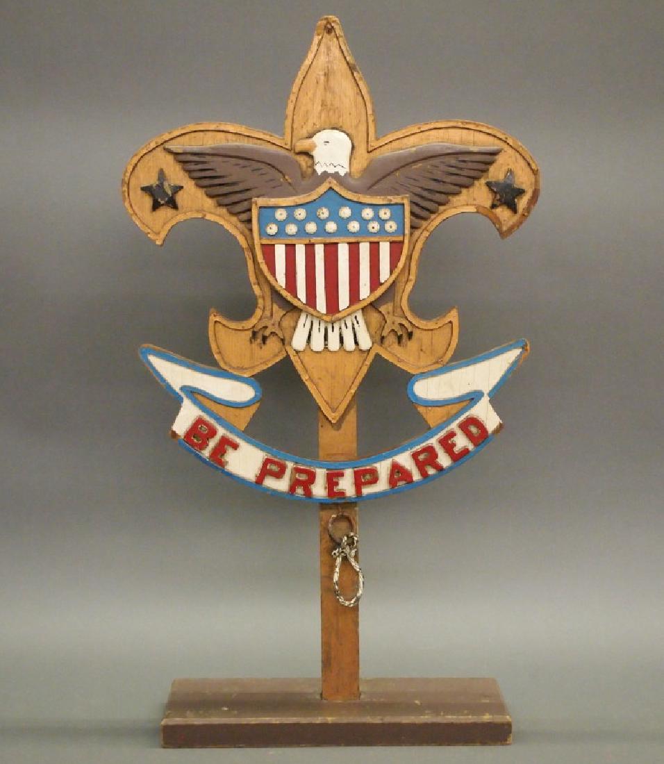 Folk Art Boy Scouts flag stand: An American Folk Art Boy Scouts "Be Prepared" flag stand. Painted wood. Losses. 28 1/2" high. ESTIMATE $200-300