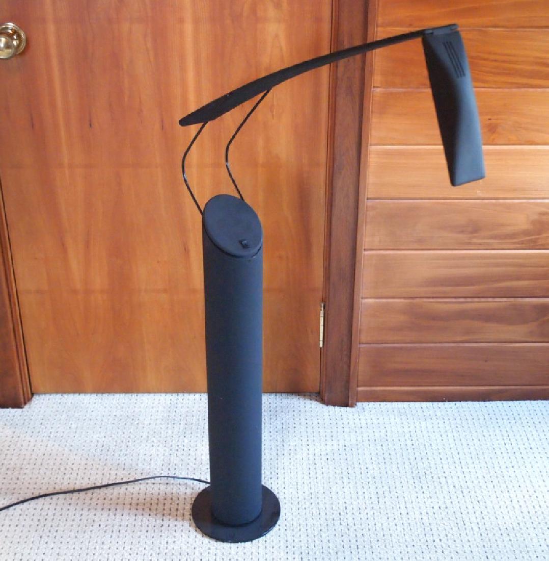 Contemporary floor lamp: A contemporary black metal floor lamp. Unmarked. Minor wear. 37" high. ESTIMATE $40-60