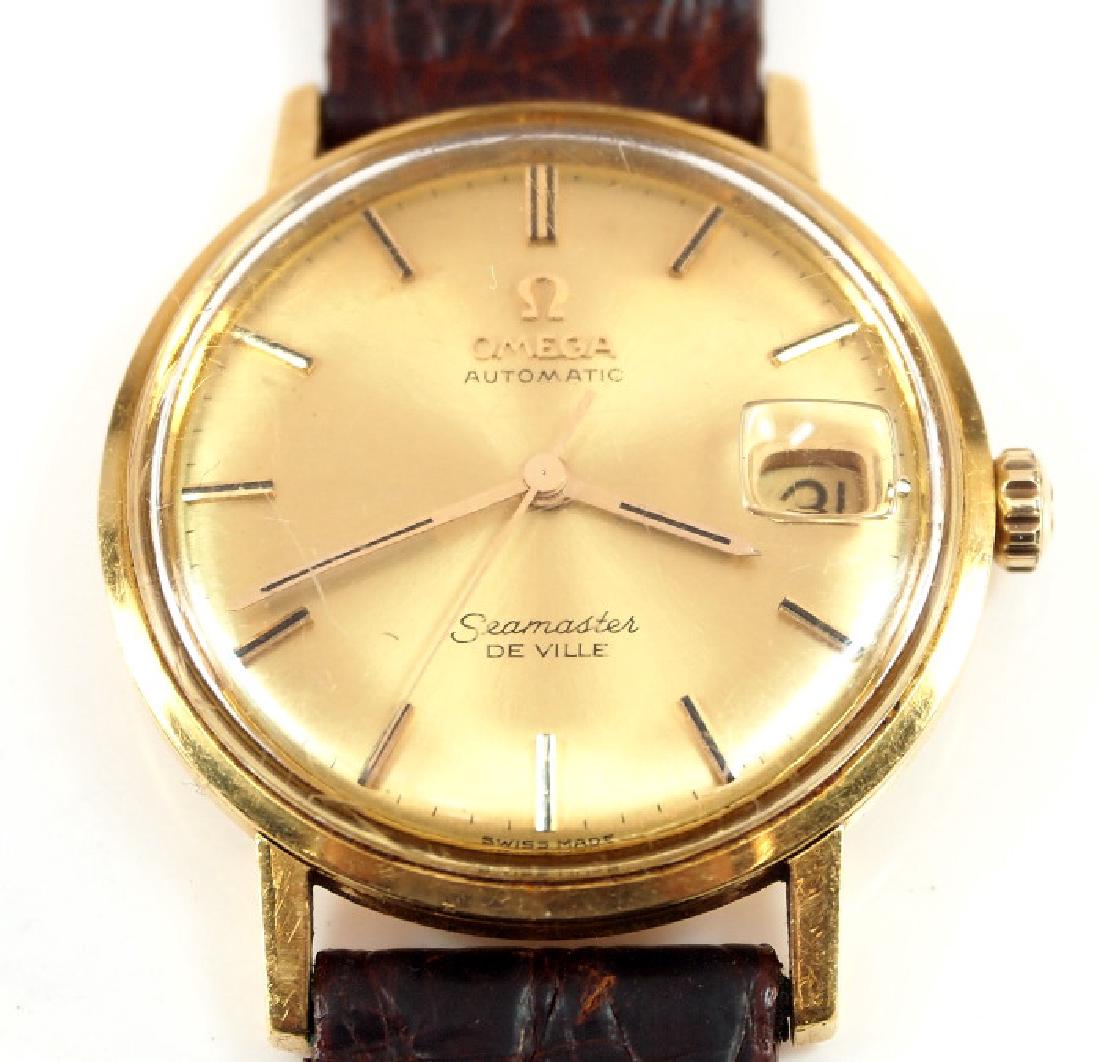 Omega Seamaster DeVille wristwatch: Omega 14k Seamaster DeVille men's wristwatch, 33mm, auto wind, gold tone dial with baton numerals and calendar aperture. The original Omega band is very worn. Winds, sets and running when catalogued.
