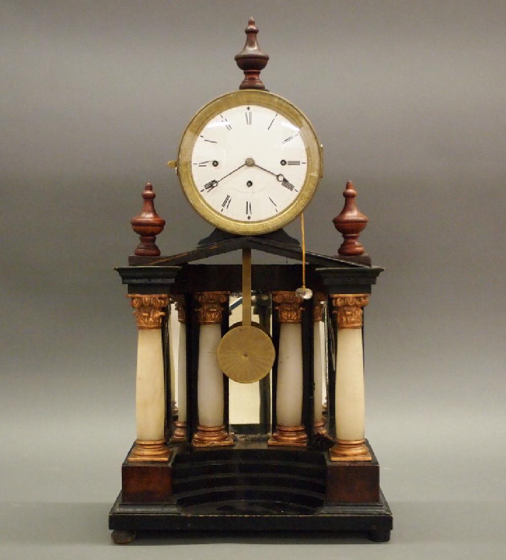 Austrian shelf clock: An early 19th century Austrian mahogany Grand Sonnerie shelf clock. 8-day time and quarter-hour strike, silk thread suspension. Architectural case having a circular enameled dial marked "Sandhaas in W