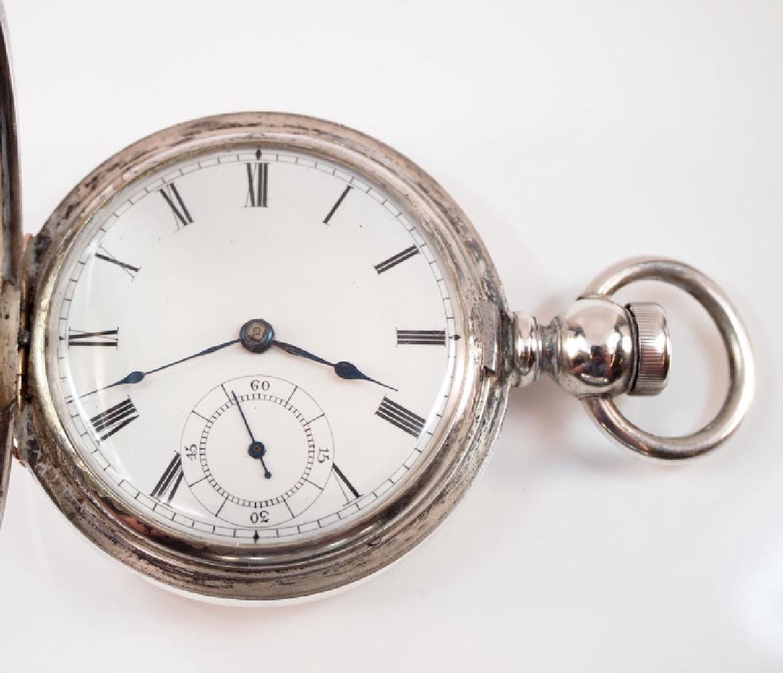 AWW Co. "Broadway" pocket watch: AWW Co. "Broadway" pocket watch, 18 size, 7 j, KW, KS, in a Waltham sterling silver case, HC, with engraved design on both sides, flat porcelain dial with Roman numerals. Serial #1444661. Winds, sets 