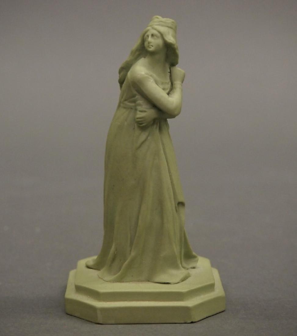 Wedgwood Queen Chess figure: An antique Wedgwood jasperware Queen Chess figure. Solid sage green, on a stepped octagonal base. Unmarked. Repaired figure; minor chips to the base. Originally designed by John Flaxman in 1783, based