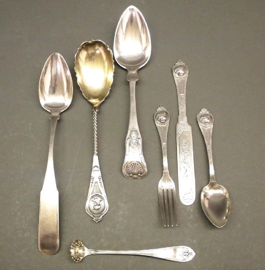 7 pcs Coin flatware: Early-mid 19th century American coin silver flatware. In the "Medallion" pattern, 1 serving spoon by Albert Coles of New York, with a gilt wash bowl, engraved monogram on the reverse and stamped with 