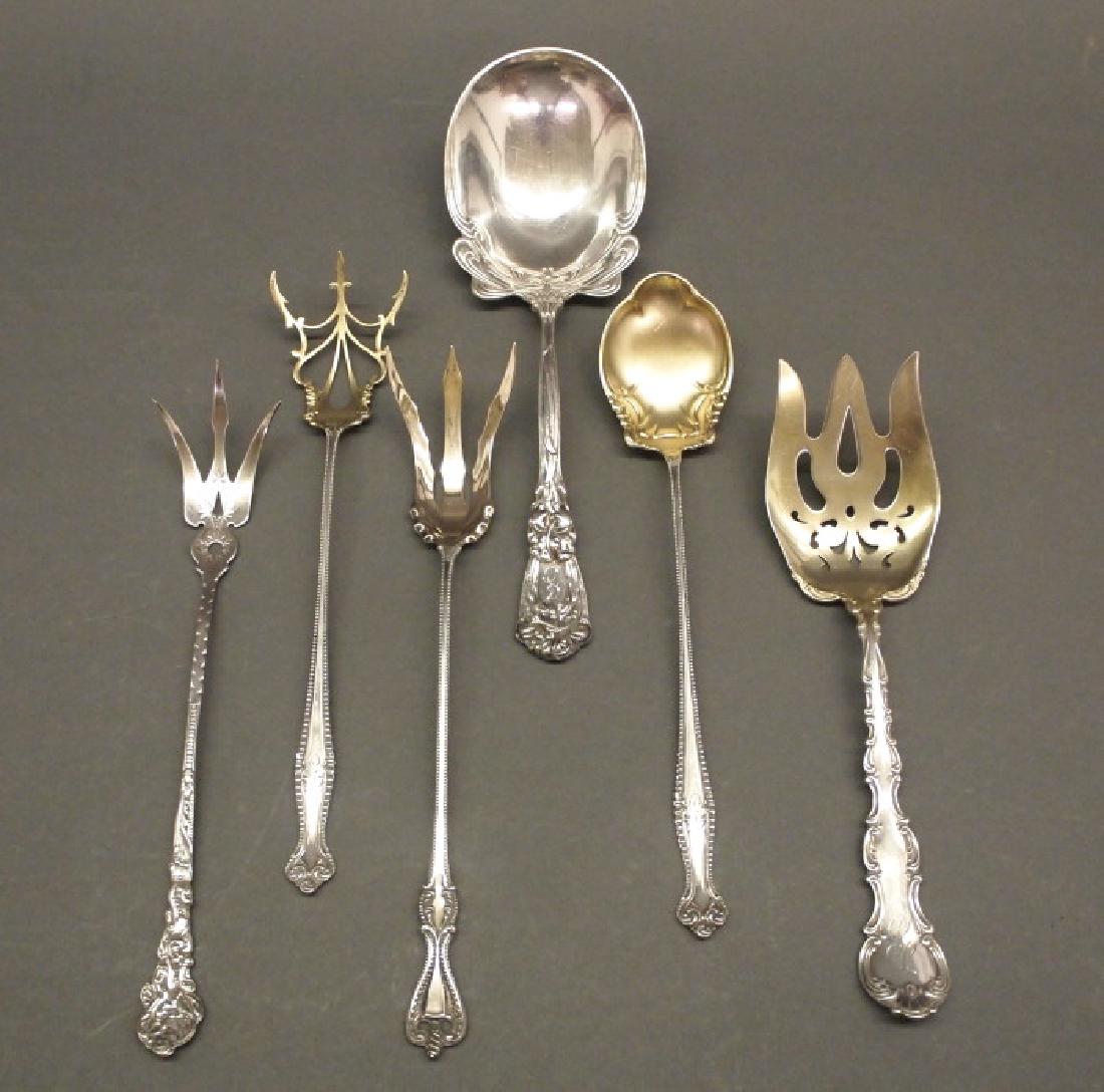 6 American serving pieces: Six American sterling silver serving pieces, circa 1900. Including, by Durgin, 1 "Iris" pattern solid salad serving spoon; by Gorham, 1 "Versailles" lettuce serving fork, and 1 "Strasbourg" solid sala