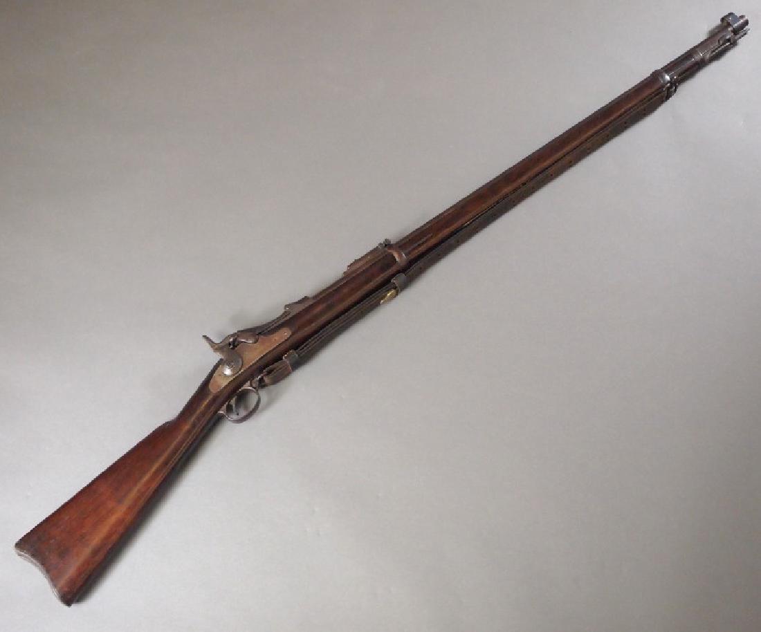 U. S. Springfield Model 1884 Trapdoor rifle: A U. S. Springfield Model 1884 Trapdoor rifle. 45/70 caliber, with rear sight, sling swivels and leather strap. Stamped "U. S. SPRINGFIELD" with eagle, "U. S. MODEL 1884" on the block, "VP" with eagle