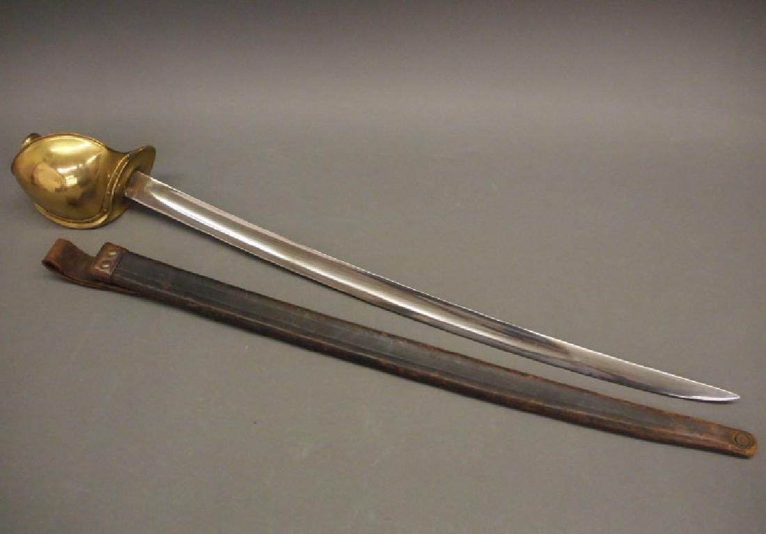 Ames Model 1860 Naval Cutlass: An Ames Model 1860 U. S. Naval Boarding Cutlass. Rounded sheet brass hilt guard, leather grip, and scabbard. The reverse ricasso is stamped "Made by/AMES MFG. CO./CHICOPEE/MASS.", and "USN/DR" and ill