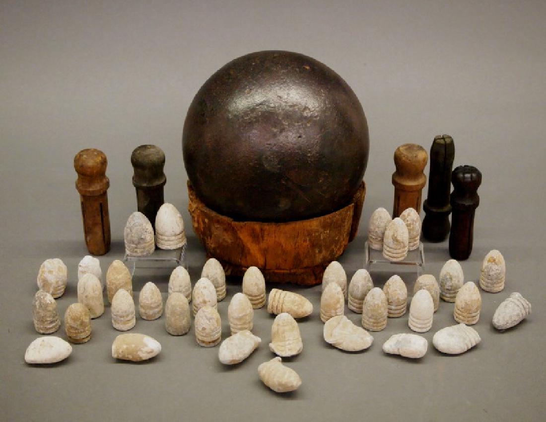 Civil War era ammunition and accessories: A group of Civil War era ammunition and accessories. Retrieved from a battlefield, including 40 Minie Balls, 58 and 69 caliber; 5 wood tompions (gun barrel plugs), 58 and 69 caliber size; and 1 cannon