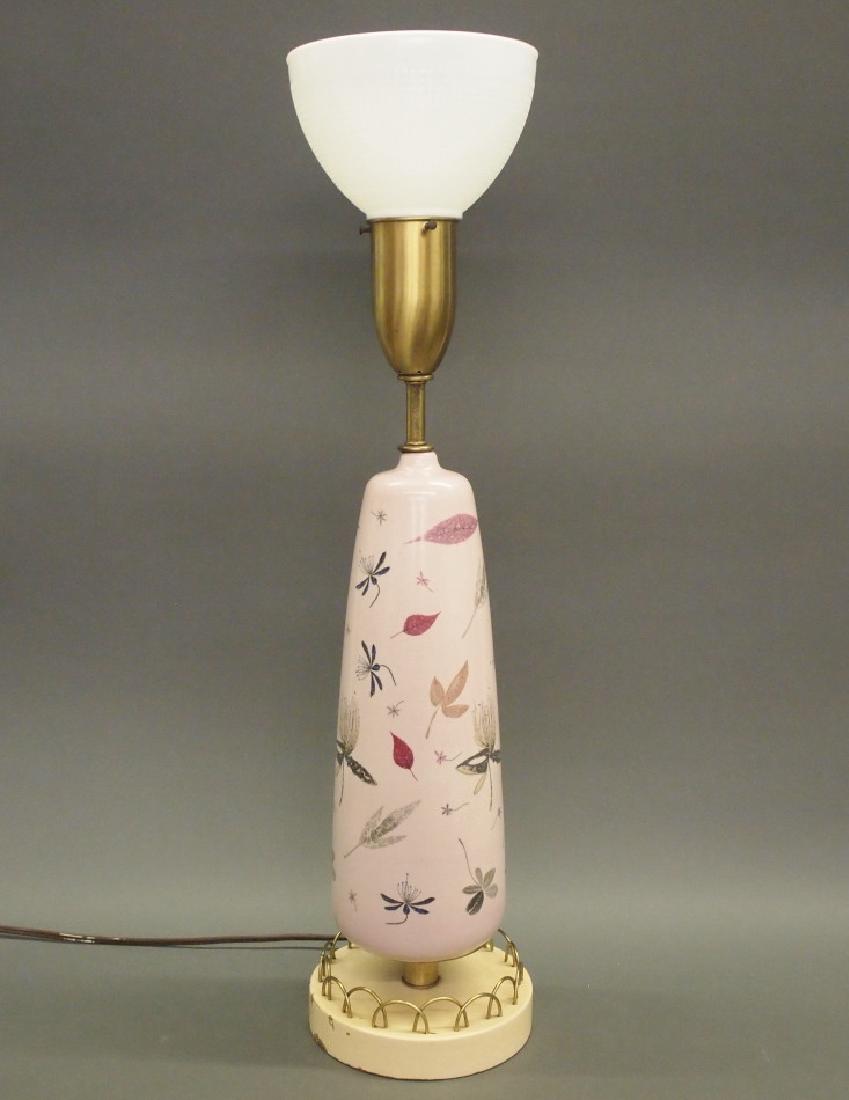 Eva Zeisel "Caprice" for Rembrandt table lamp: A 1950's label lamp. Eva Zeisel's "Caprice" pattern earthenware body on a painted base with Brass accents by Rembrandt. Some wear, paint loss to the base, no shade. 33" high including the milk glass d