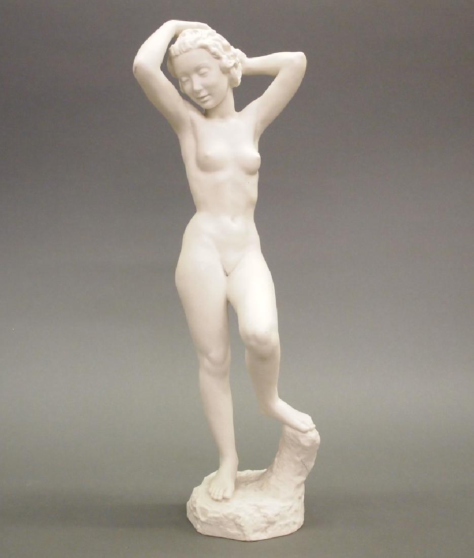 Hutschenreuther Bisque Bather: A Hutschenreuther bisque figure modeled by Carl Werner. Standing nude female with her left foot resting on a rock. Incised "C. Werner" at the edge of the base, stamped green manufacturer's mark of an