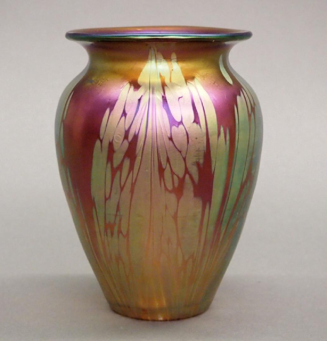 Loetz Medici vase: A Loetz Medici glass vase. Urn shape with flared rim, amber to pink ground with iridescent green spotting. Good condition. 5 3/4" high. ESTIMATE $400-600