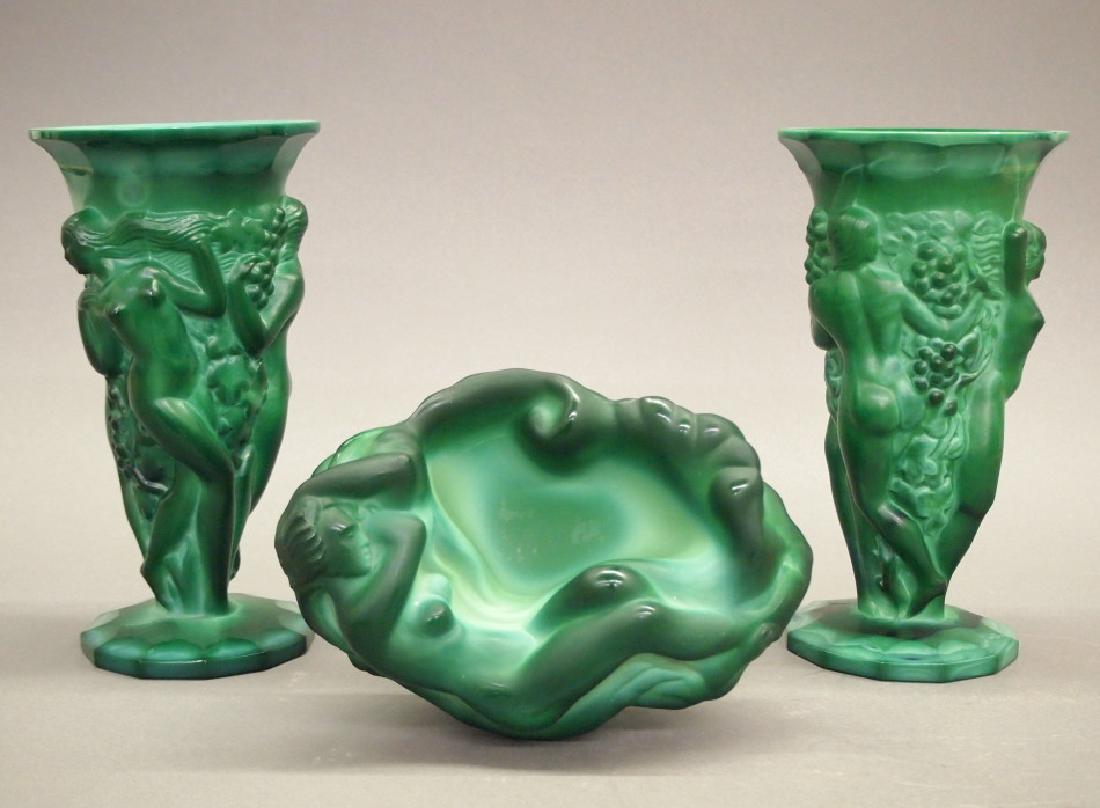 3 Czech Art Deco Malachite items: Three Czechoslovakian Art Deco glass items. Malachite green, including 2 trumpet-form vases with molded nudes and grape bunches about, and 1 oblong bowl/ashtray with sleeping nude. Both vases are sign